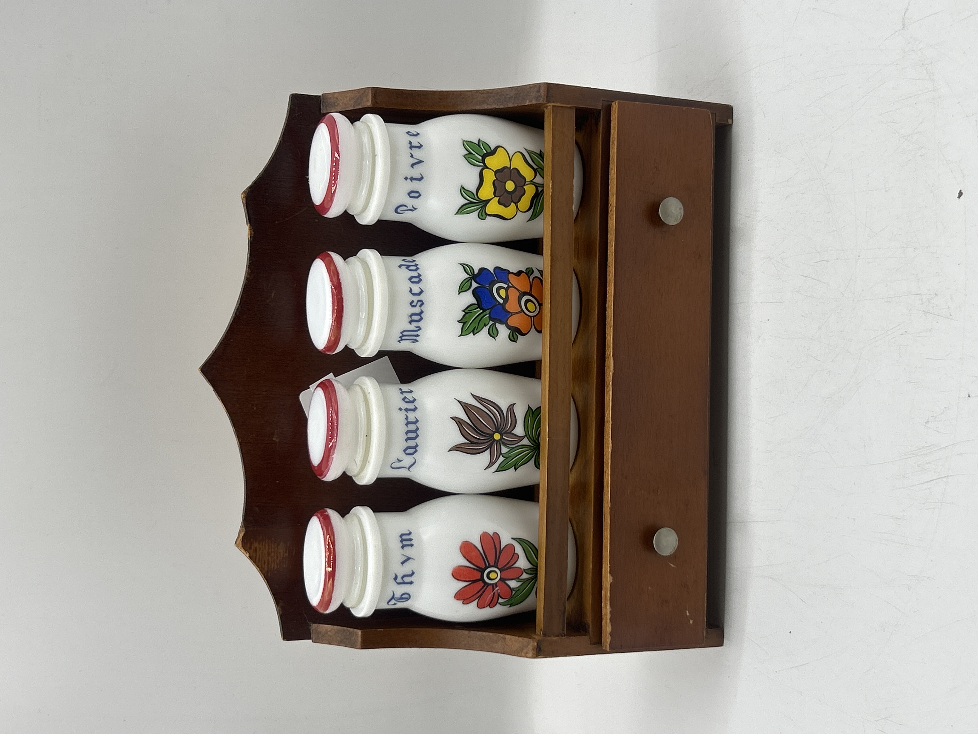 A Set of Vintage French Milk Glass Spice Jars in a Wooden Rack