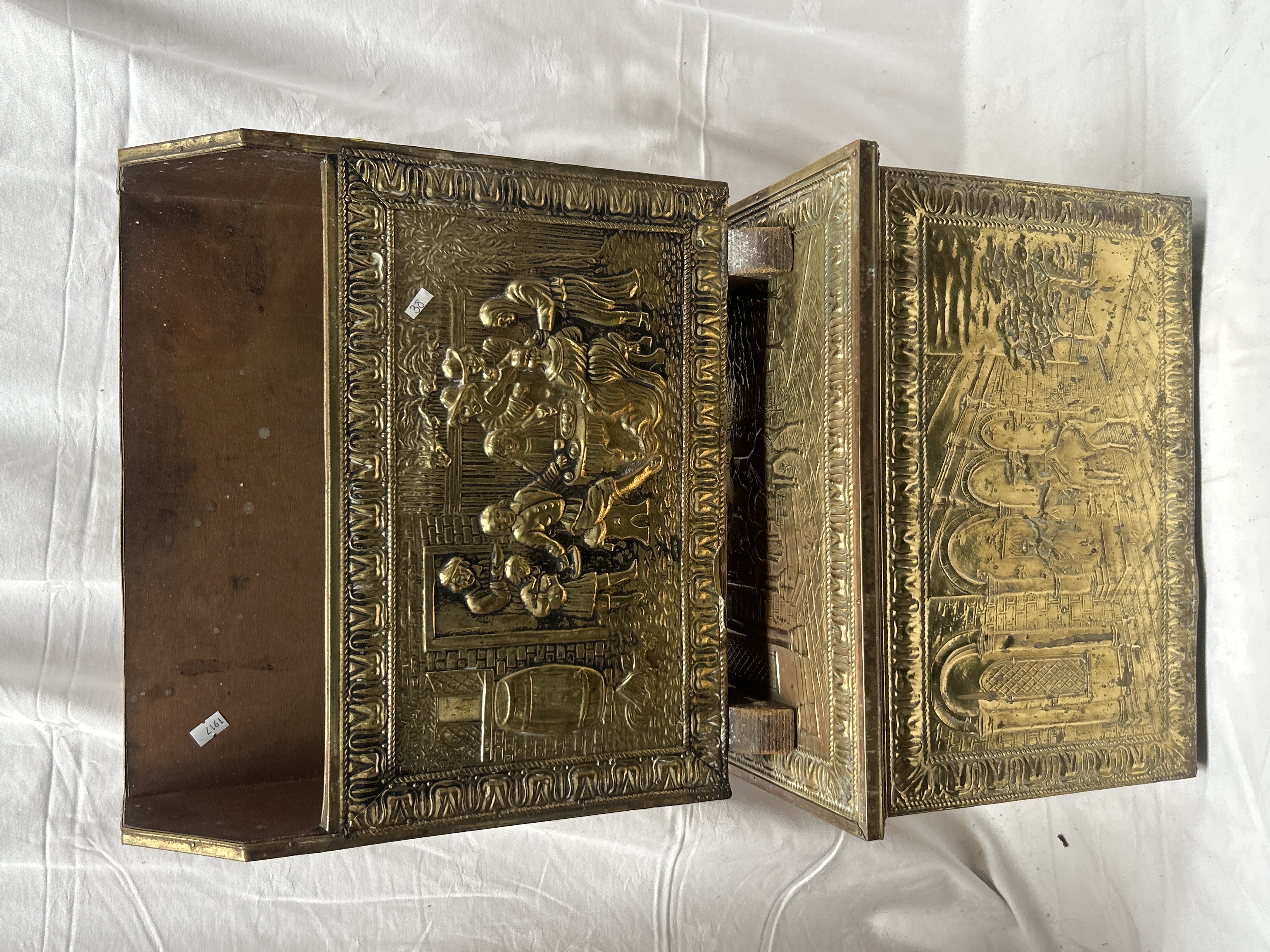 A Pair of Late 19th or Early 20th Century Embossed Brass Clad Fireside Log Boxes