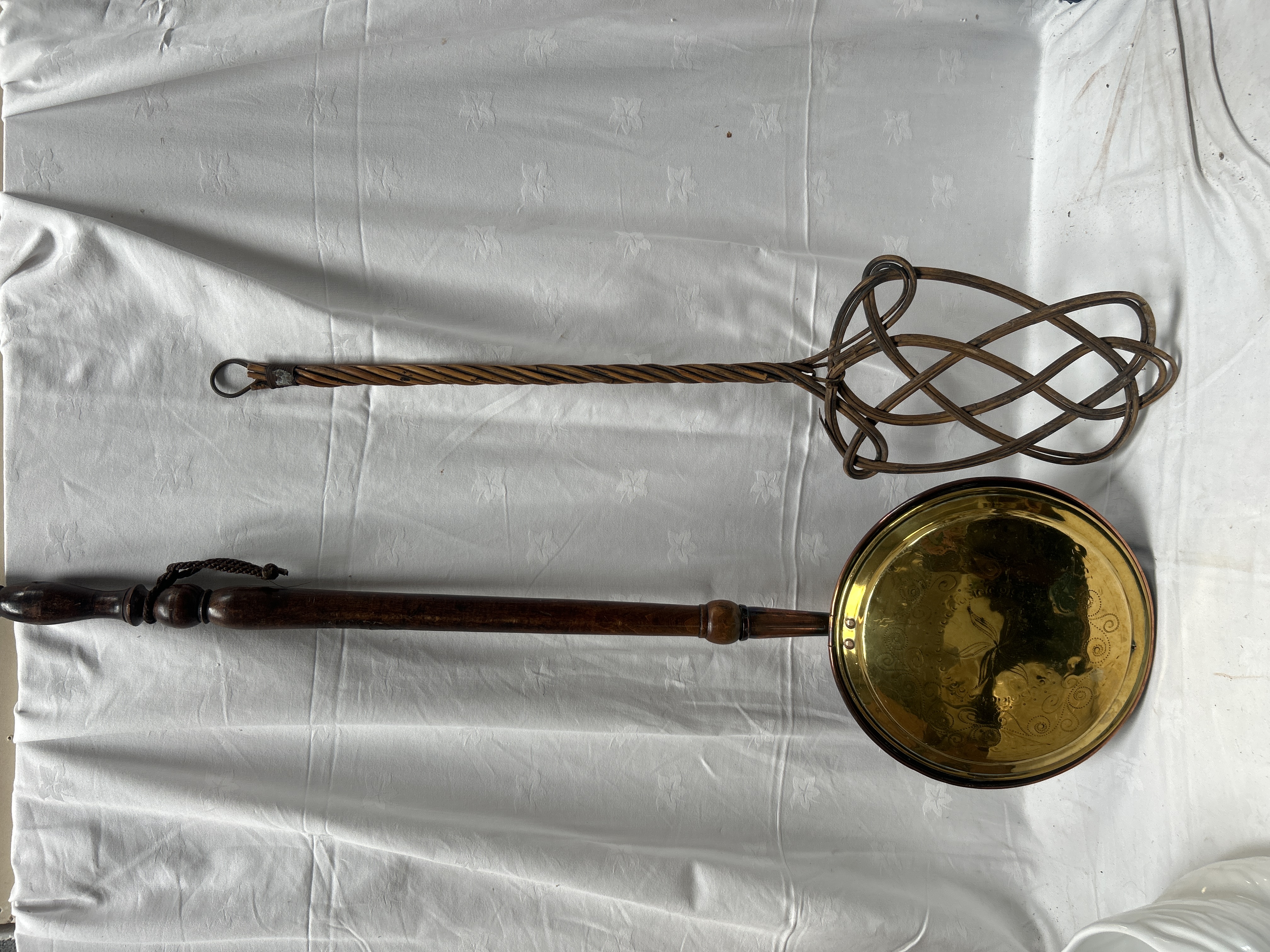 Two Antique Domestic Items Comprising a Wicker Carpet Beater and a Brass Warming Pan