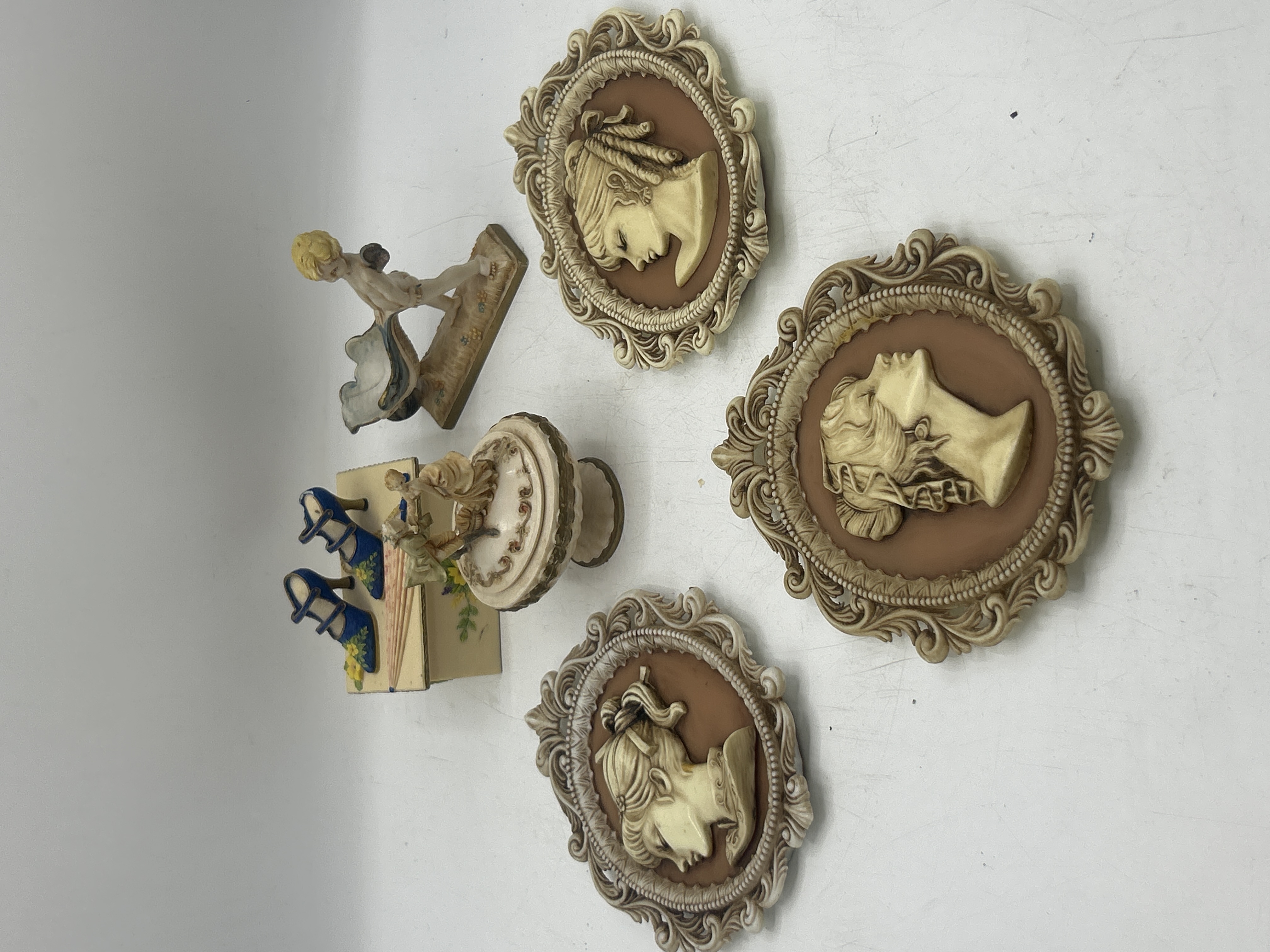 A Collection of Burwood Cameo Wall Plaques and Decorative Resin Figurines