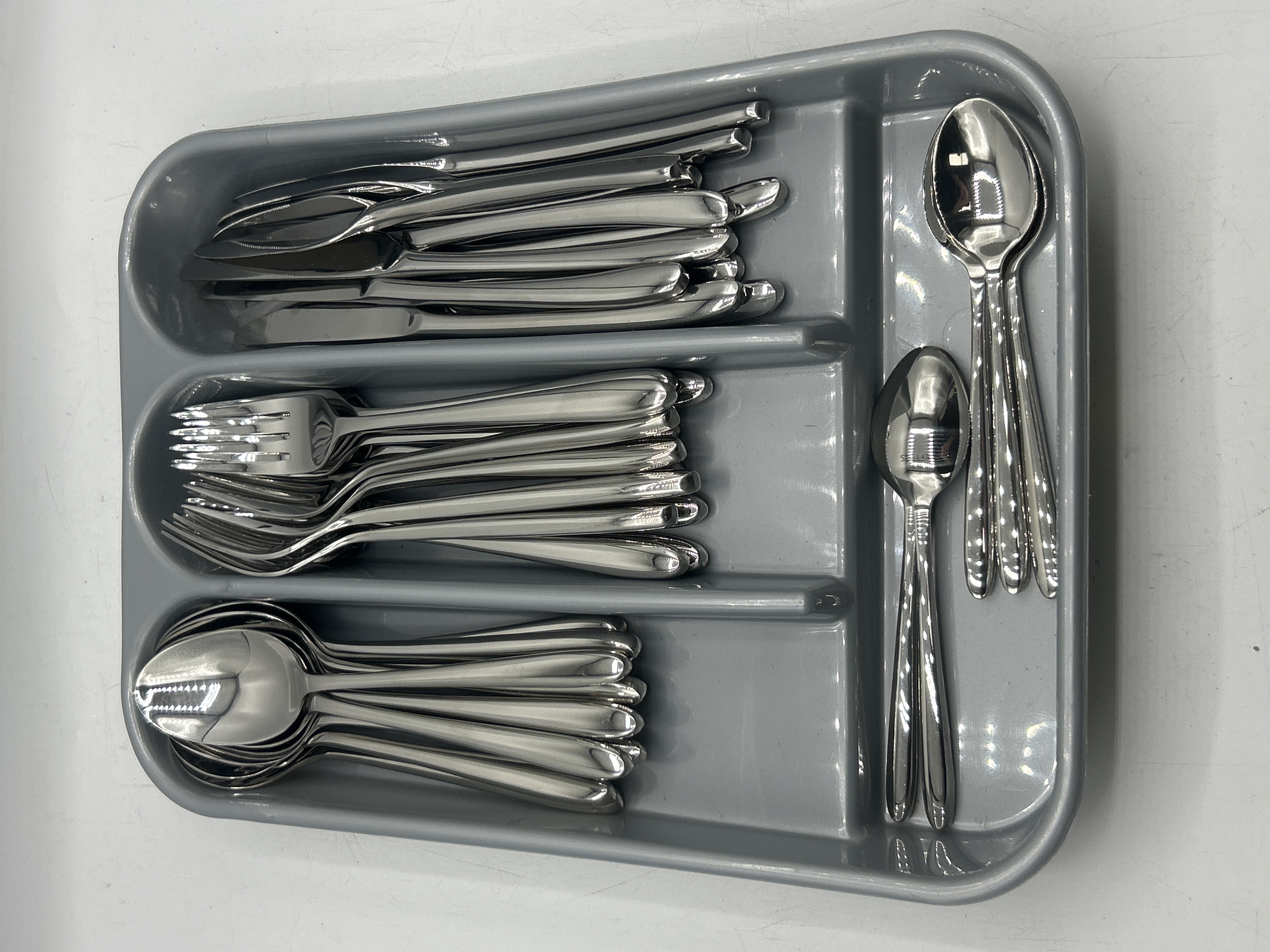 A Set of Stellar Polished Stainless Steel Cutlery and Tray