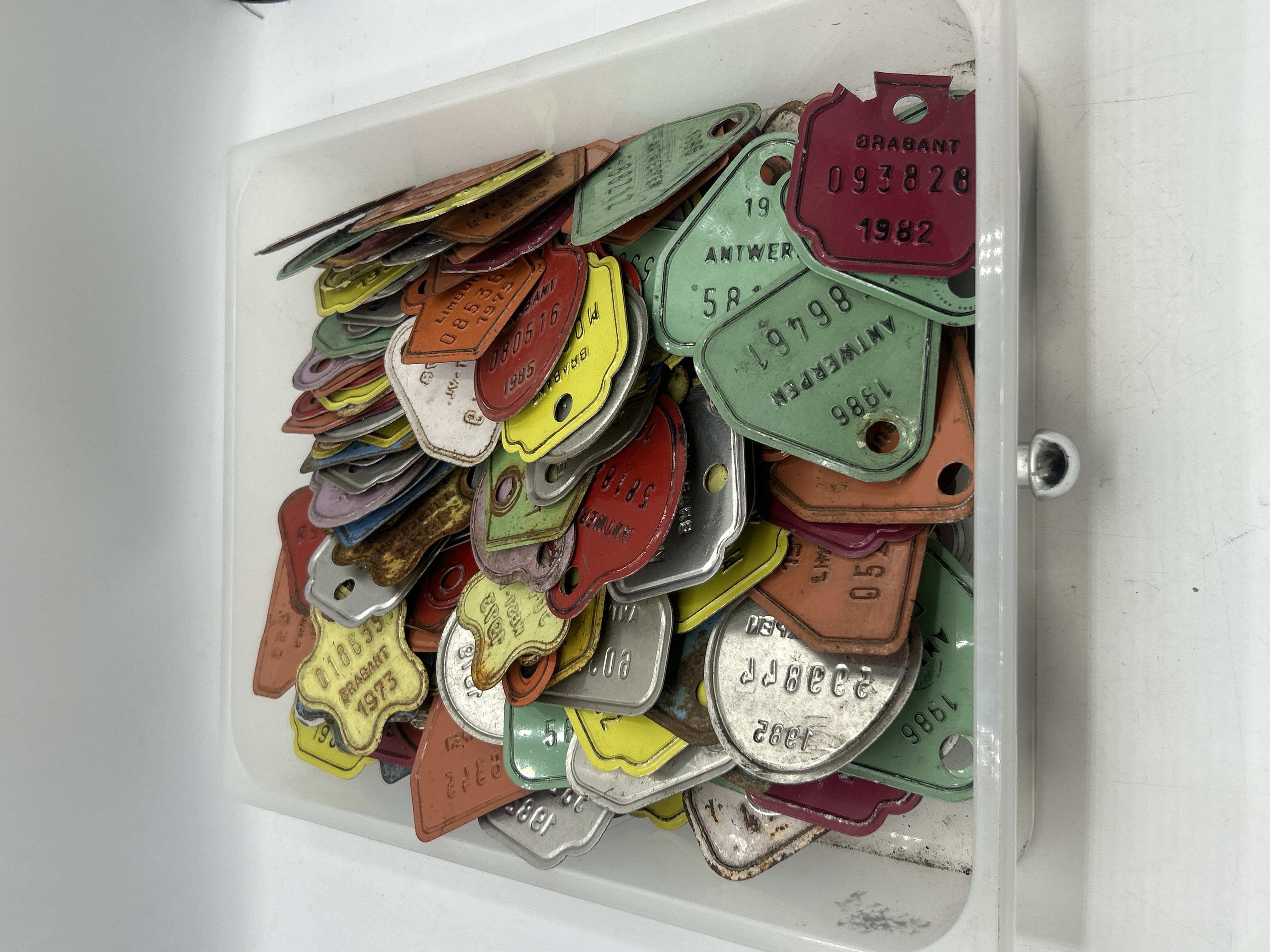 A Collection of Vintage Belgian Metal Bicycle Tax Tags