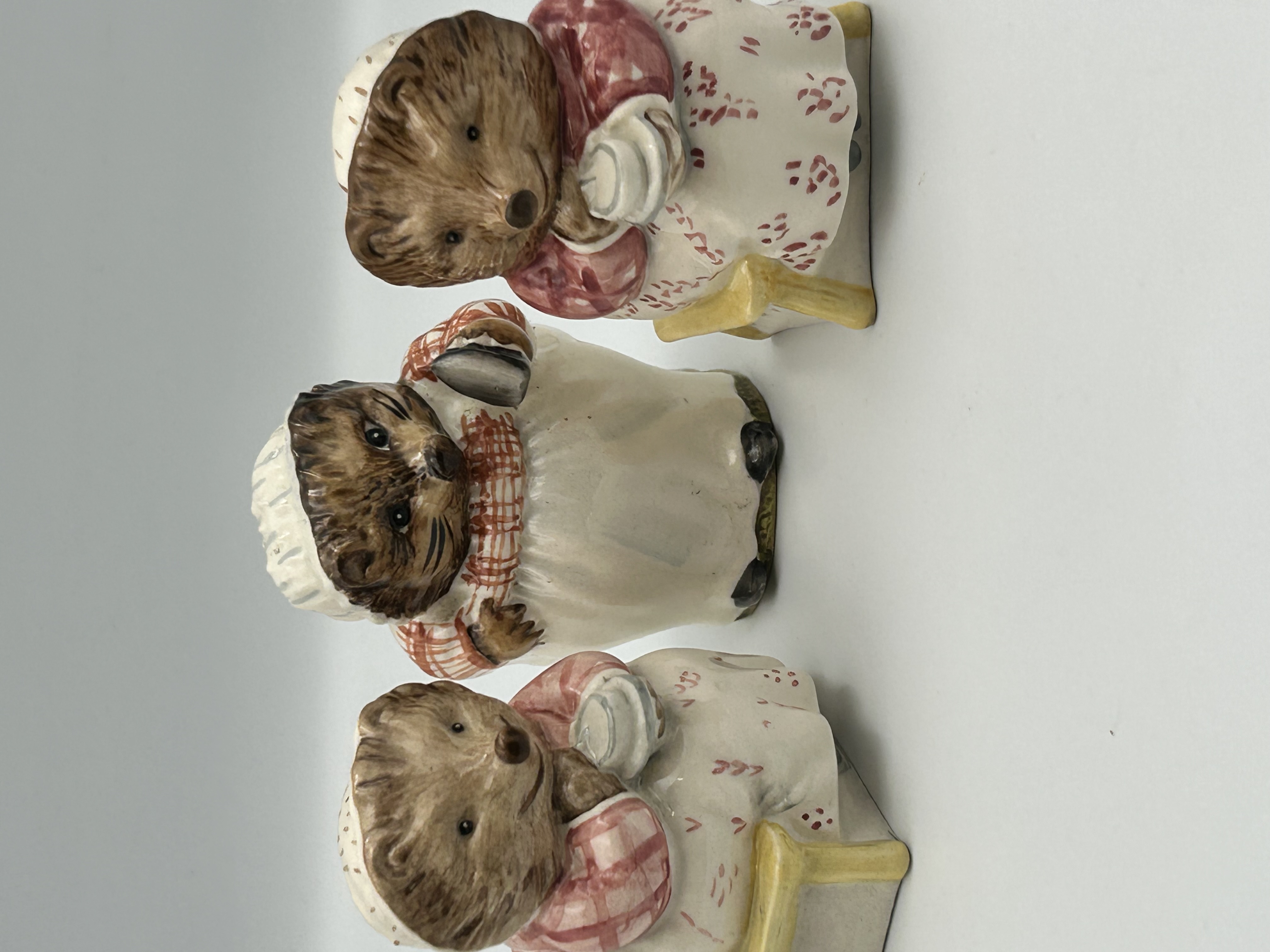 Three Beswick, Royal Albert, and Royal Doulton Beatrix Potter Mrs. Tiggy-Winkle Ceramic Figurines