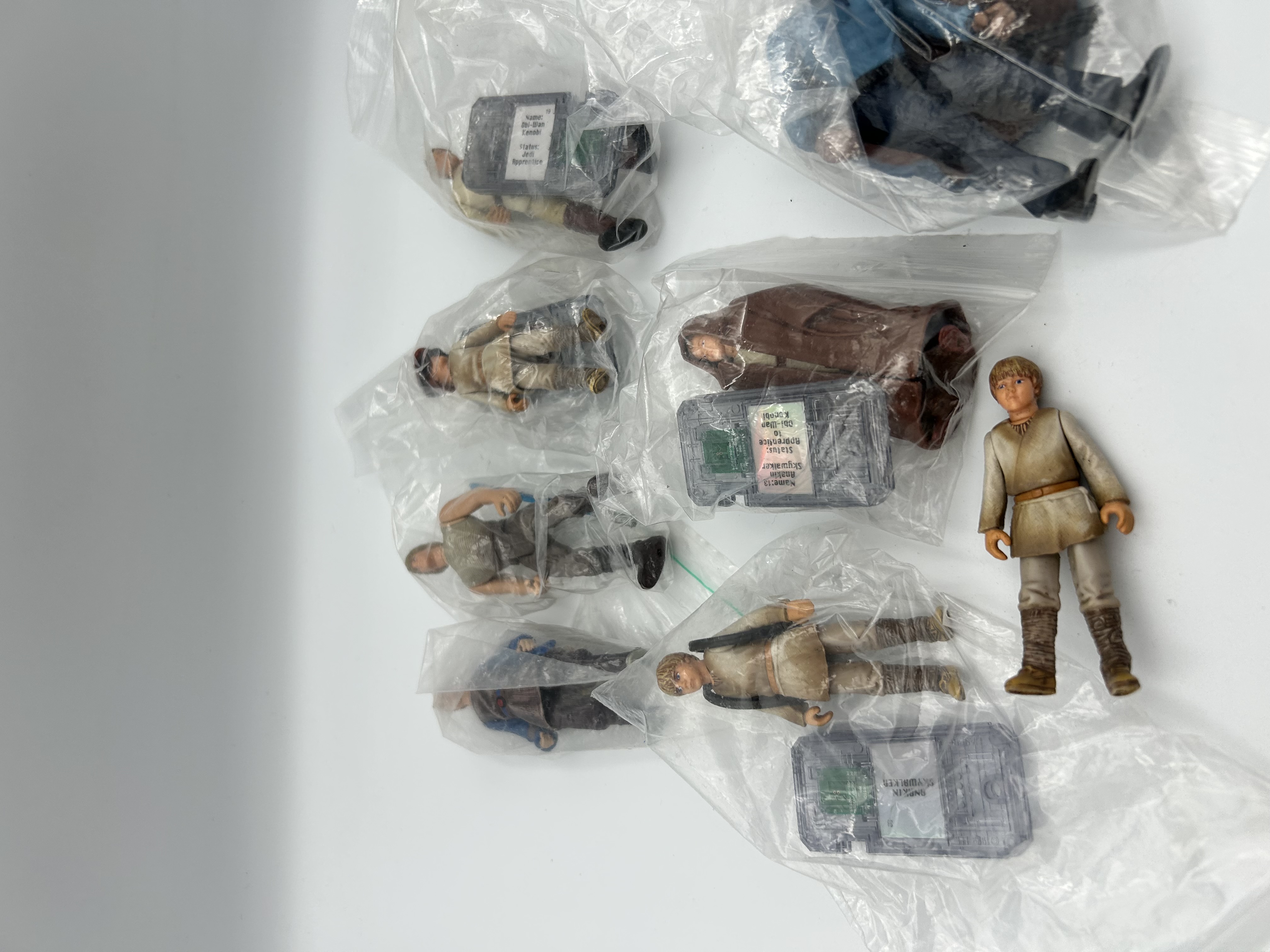 A Collection of Hasbro Star Wars Episode I The Phantom Menace Action Figures and CommTech Chips