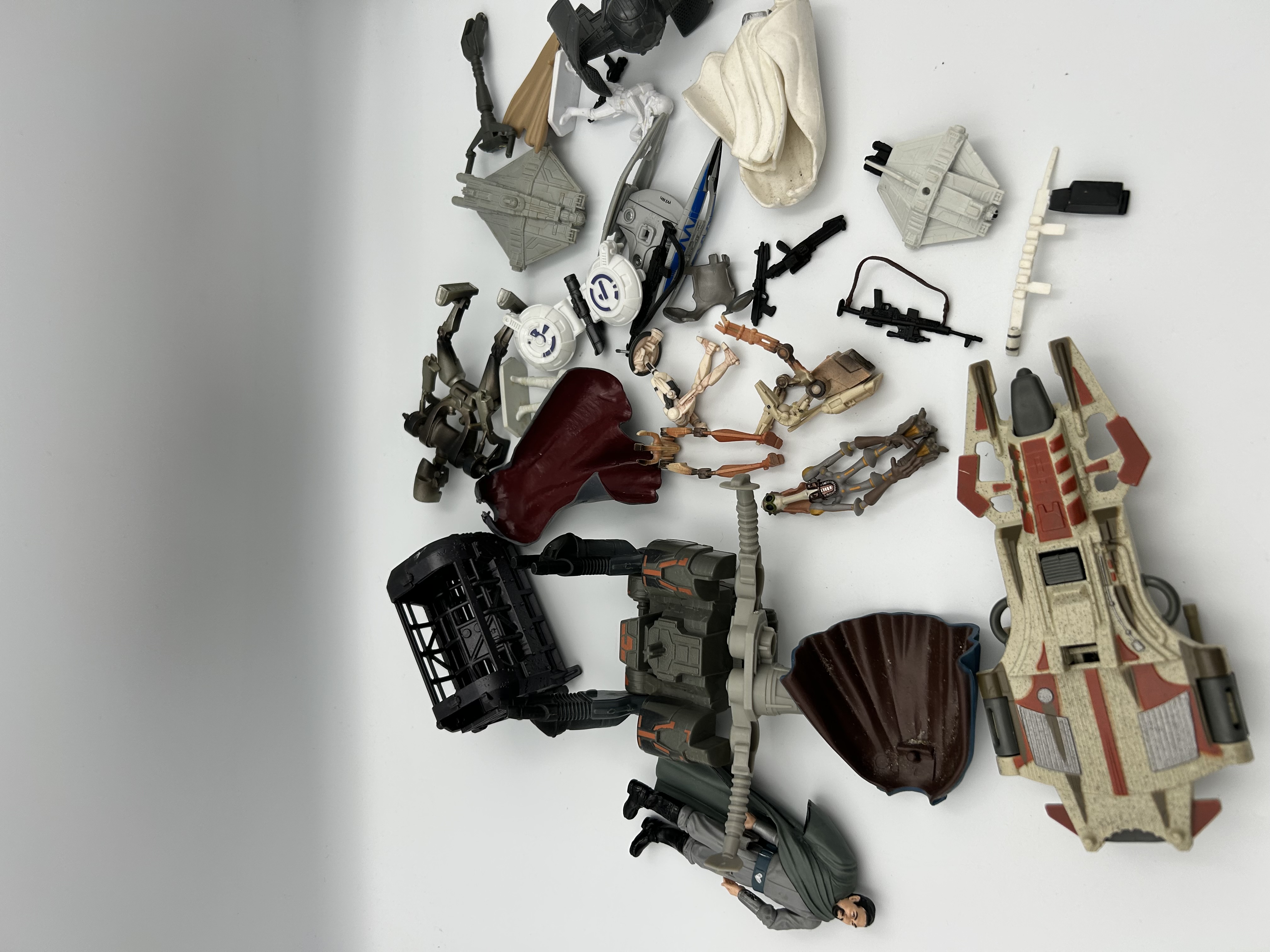 An Assortment of Star Wars Action Figures Accessories and Micro Vehicles by Hasbro and Micro Machines