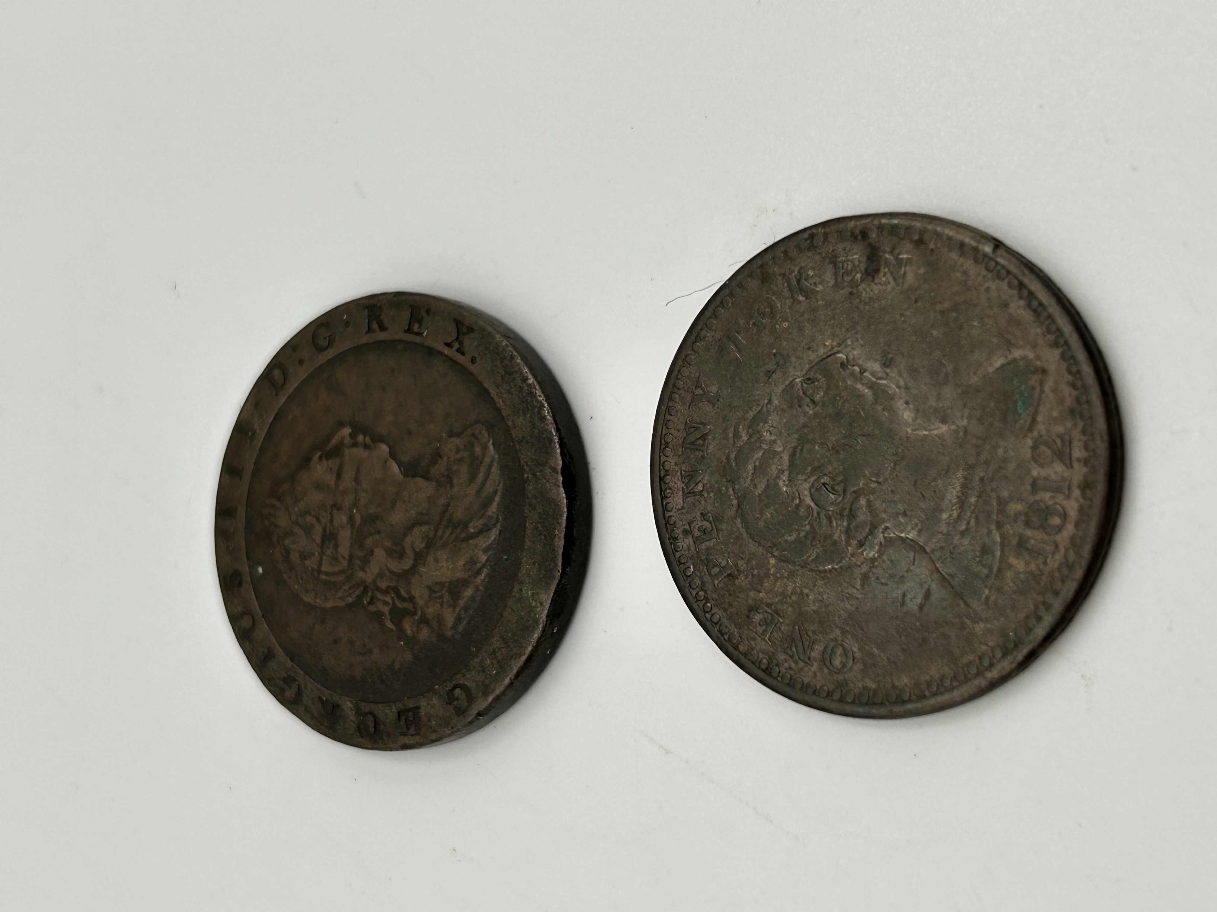 A Pair of UK Copper Coins Comprising a 1797 George III Cartwheel Penny and an 1812 Royal Exchange Token