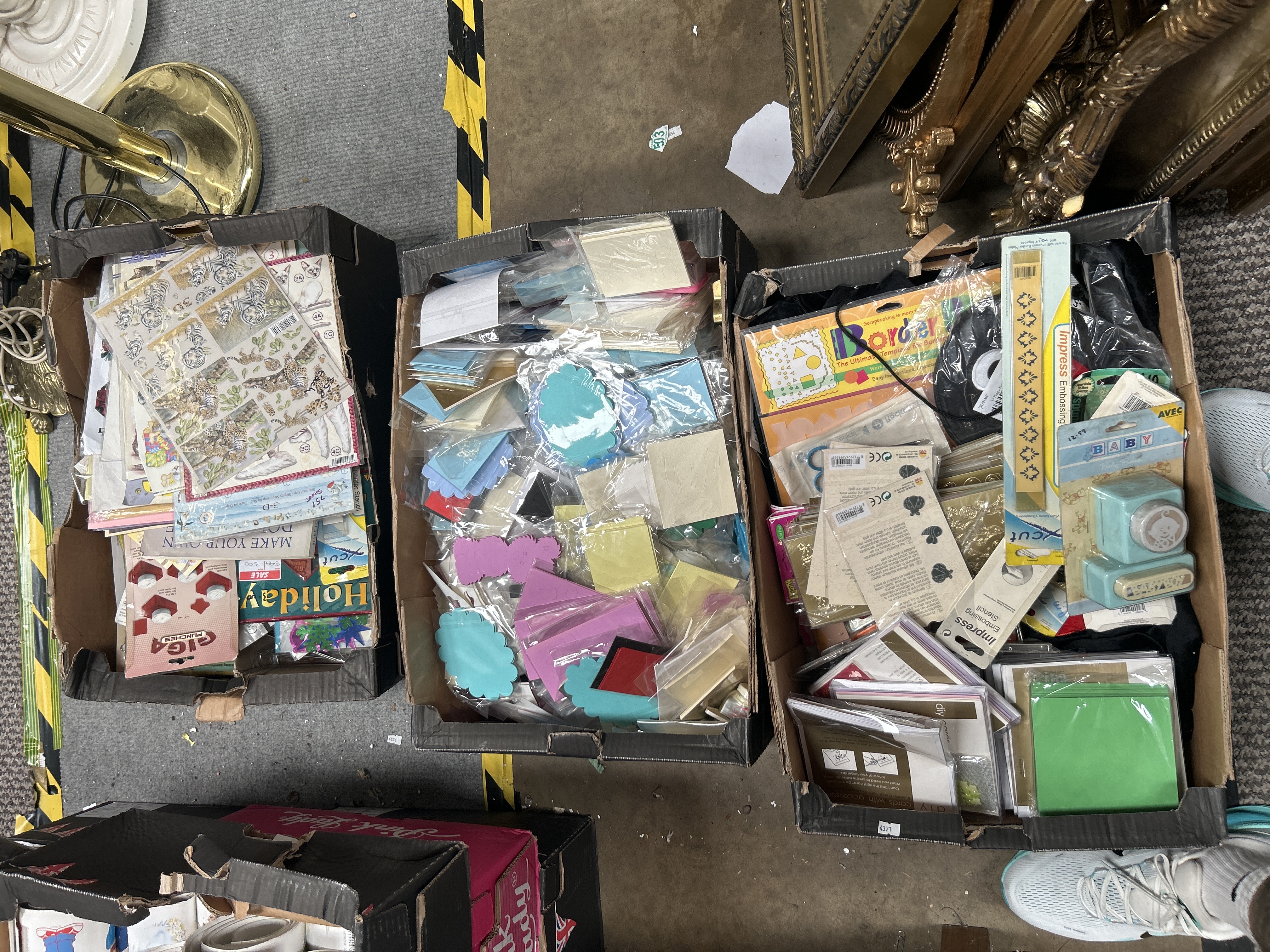 A Collection of Scrapbooking and Card-Making Supplies Including Xcut and Giga Punches