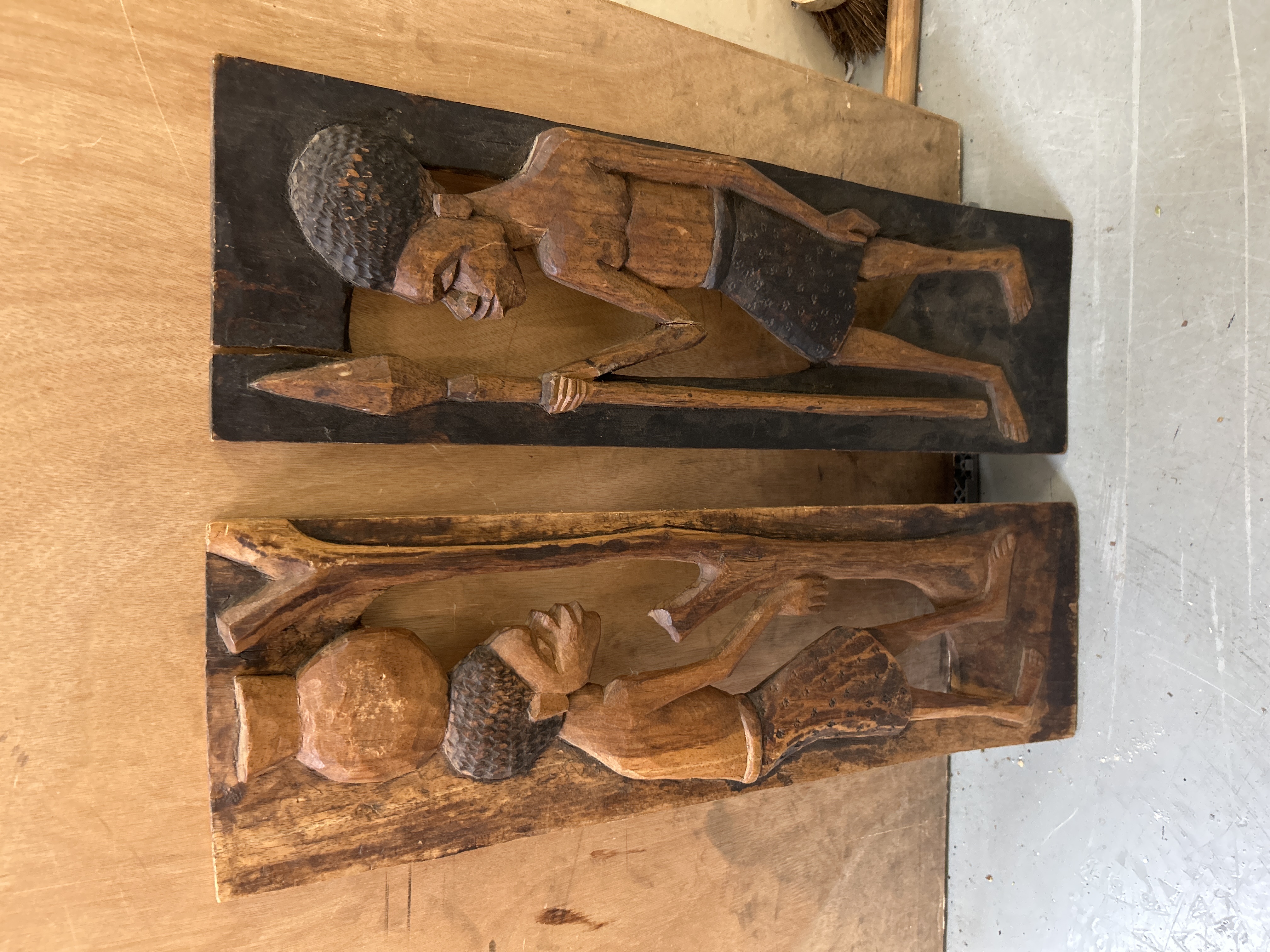 A Pair of Mid-20th Century Hand-Carved African Hardwood Relief Wall Plaques