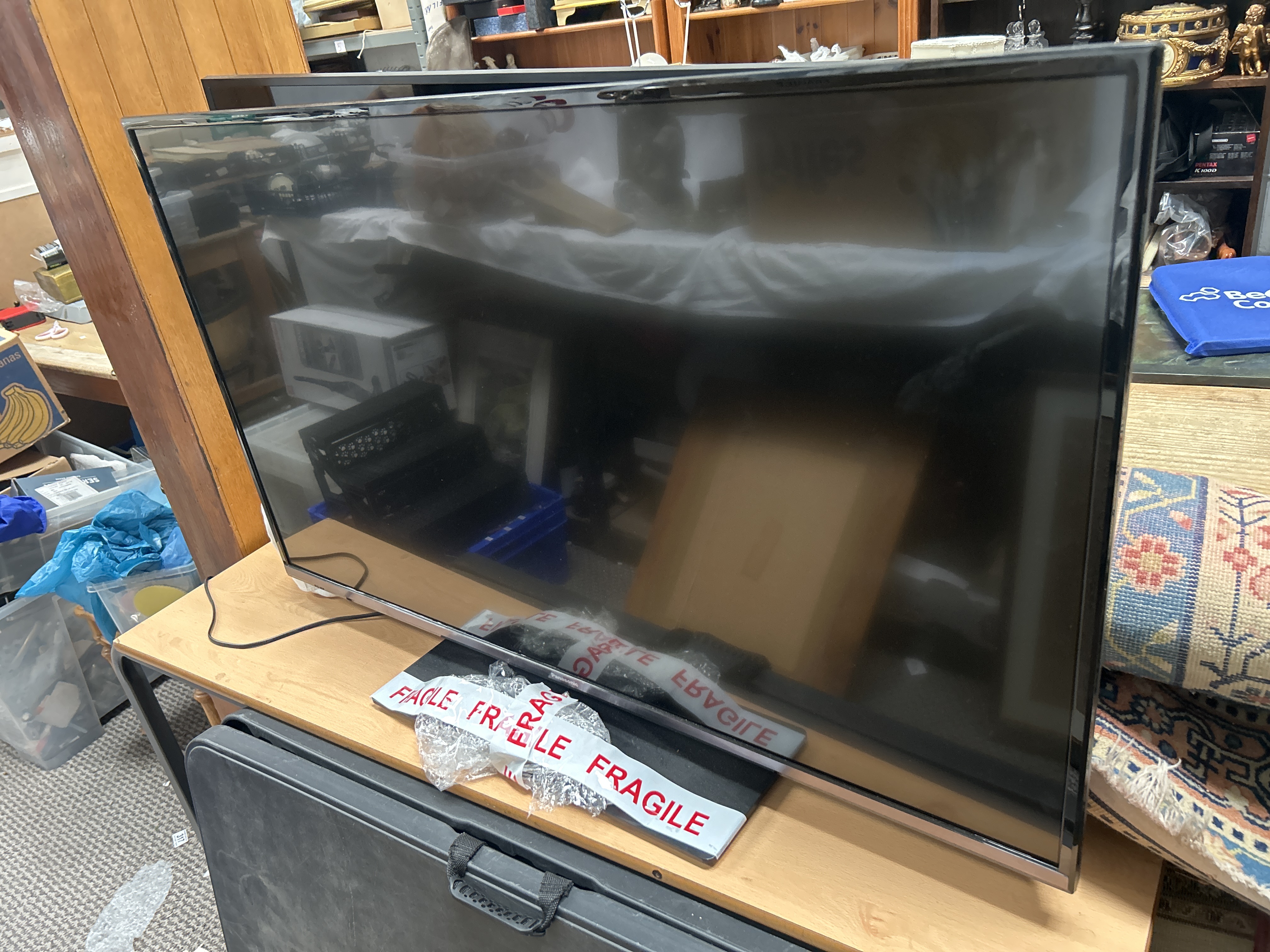 A Panasonic 42 Inch Flat Screen Television with Remote Control