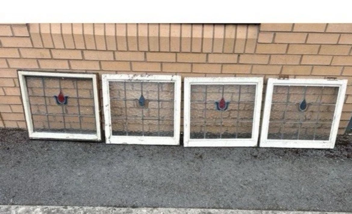 A Set of Four Edwardian Leaded and Stained Glass Window Panels in Painted Wooden Frames