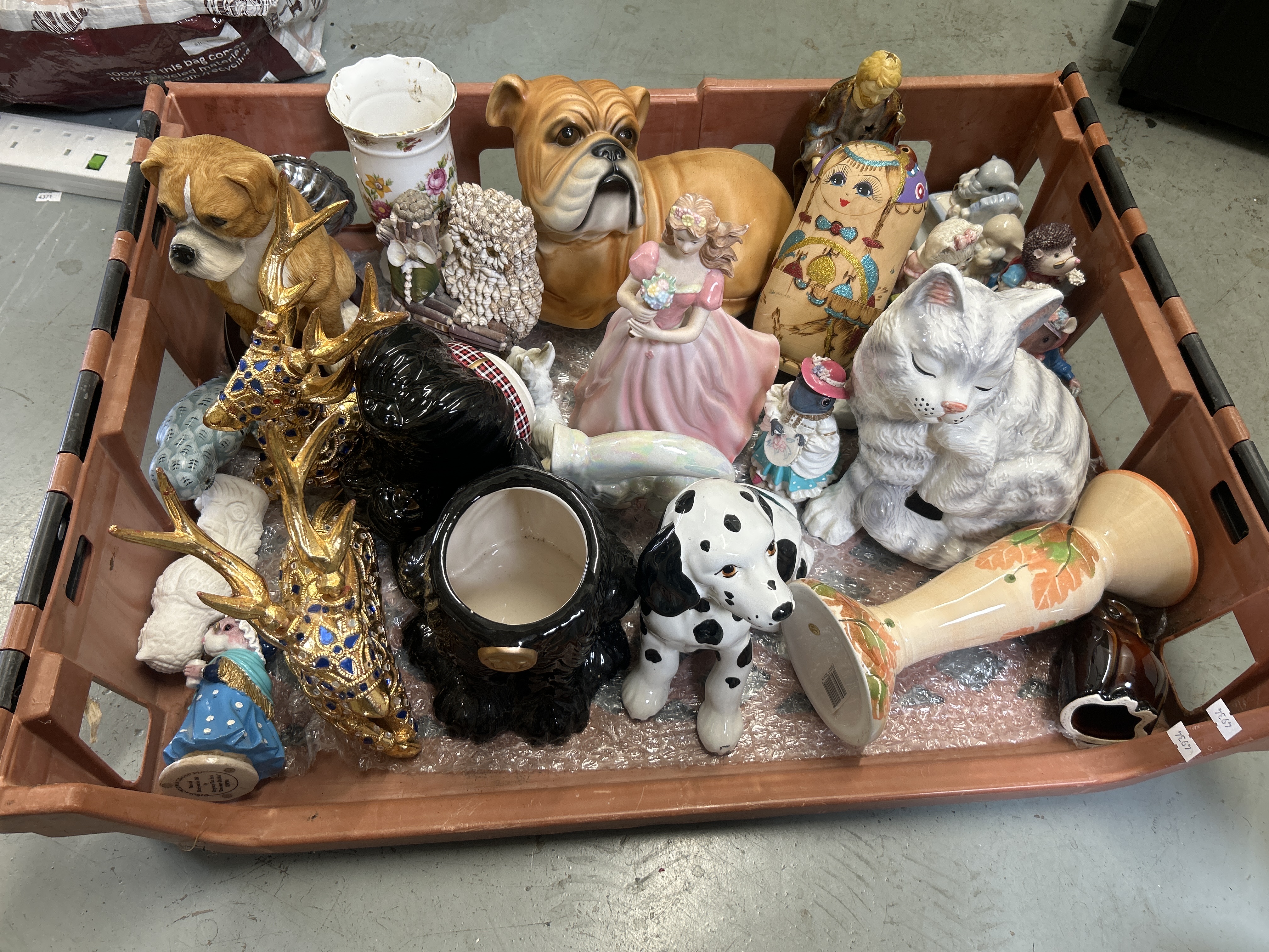 An Assortment of Decorative Porcelain and Ceramic Animal and Character Figurines