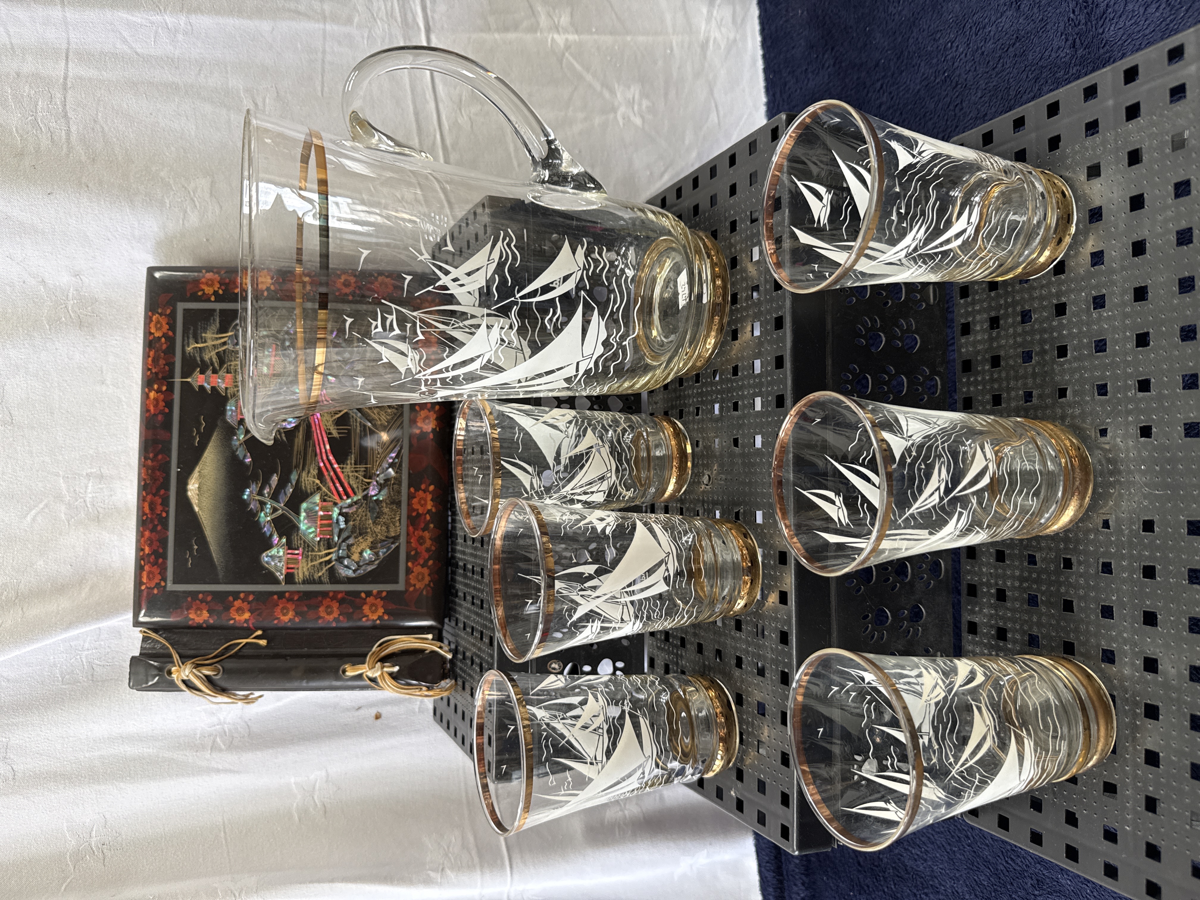 A Seven-Piece Mid-Century Nautical Glassware Set and a Japanese Lacquer Photo Album