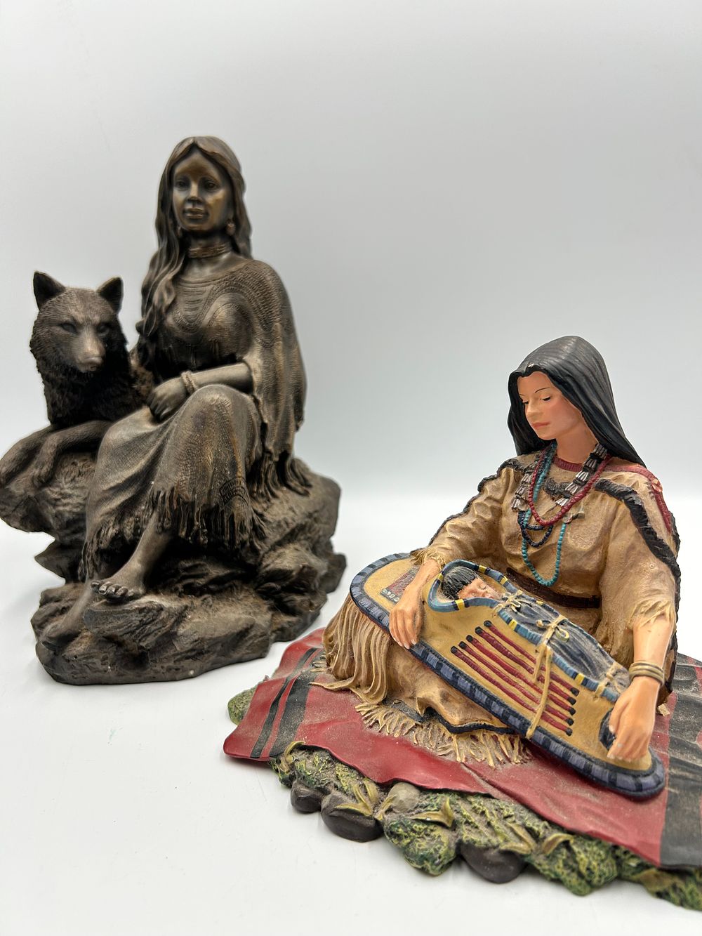 Lot 874: Two Native American Themed Resin Figurines including a 1993 Hamilton Collection Sacajawea