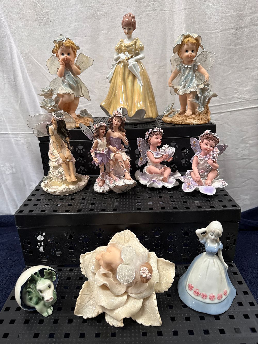 Lot 910: A Collection of Ten Decorative Fairy and Feminine Figurines