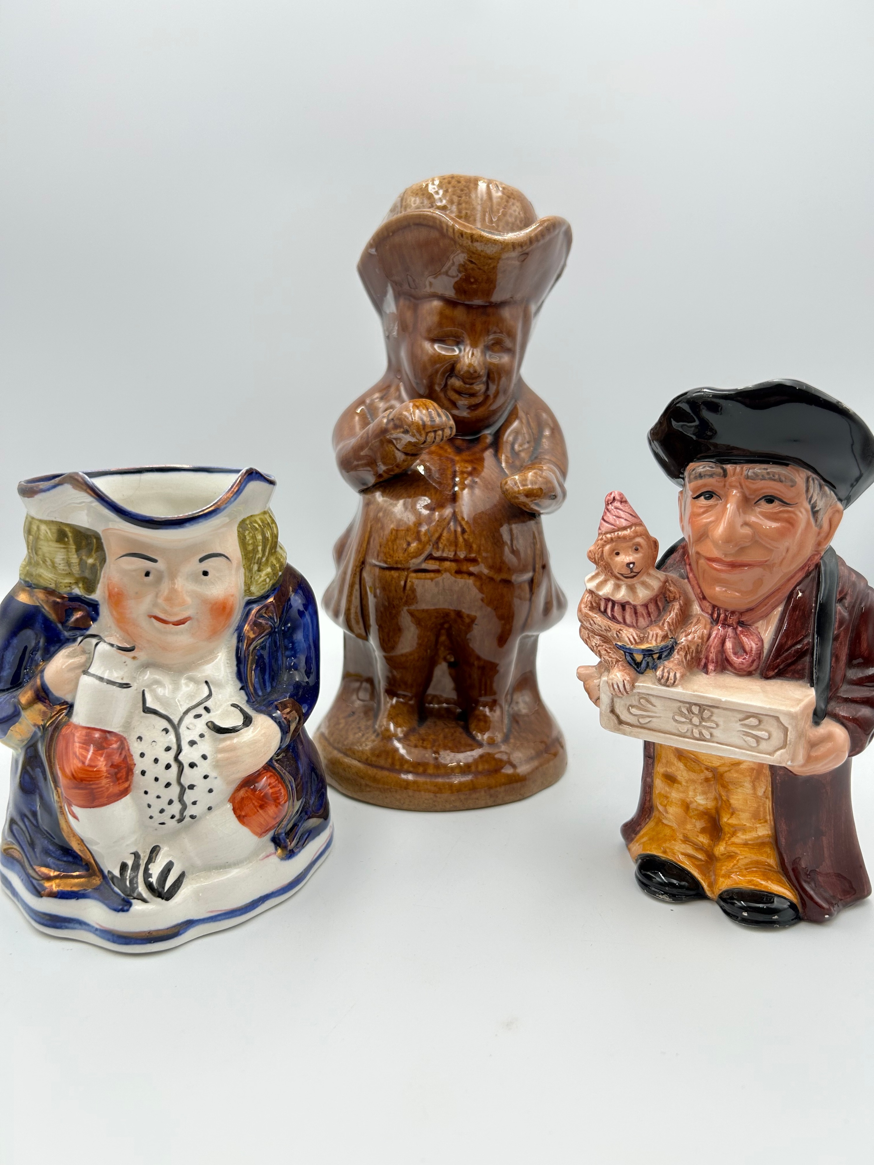 A Collection of Glazed Ceramic Character and Toby Jugs