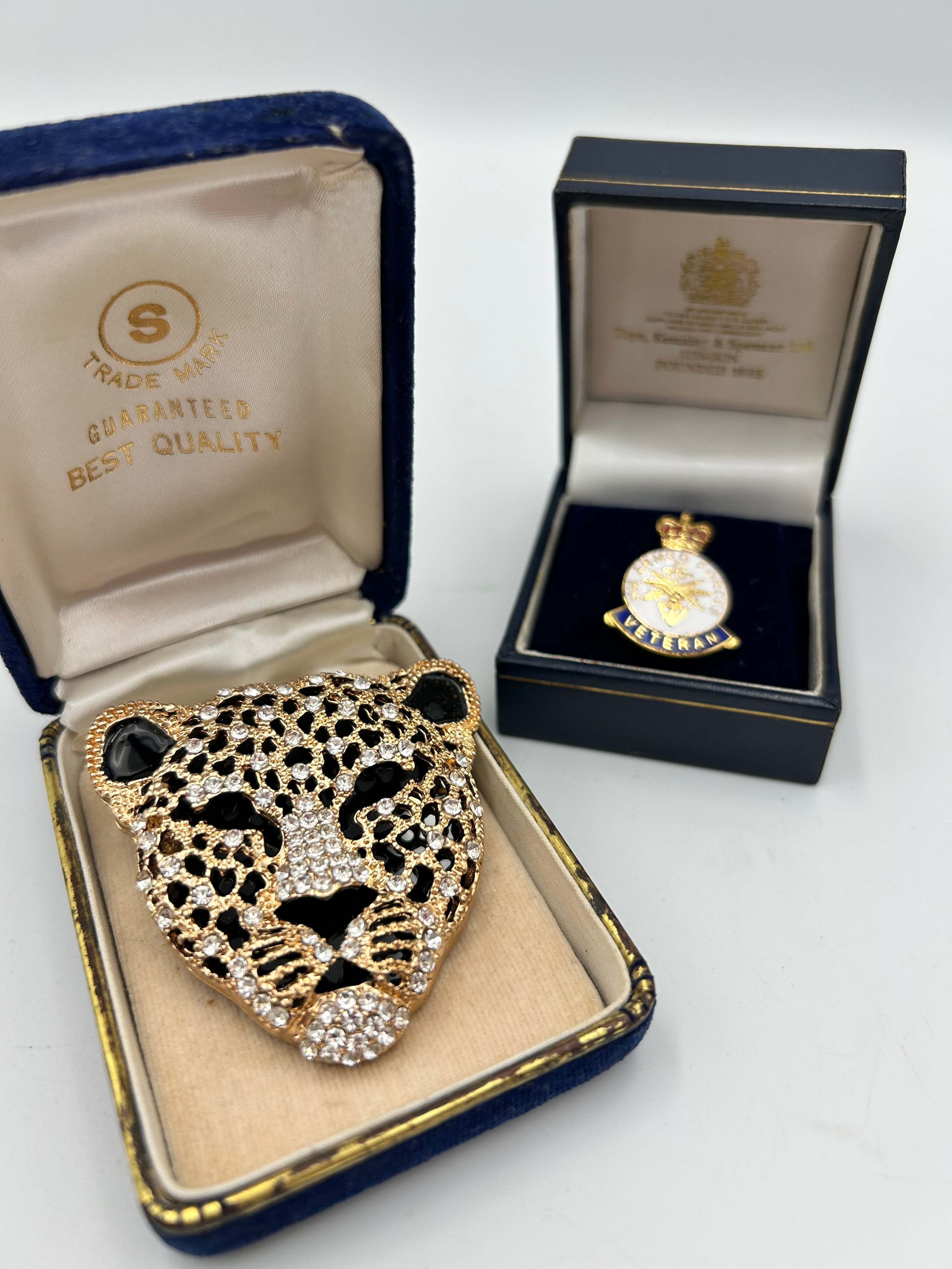 Gilt-Metal Effect Veteran's Badge by Toye, Kenning & Spencer Ltd and a Leopard Head Costume Brooch