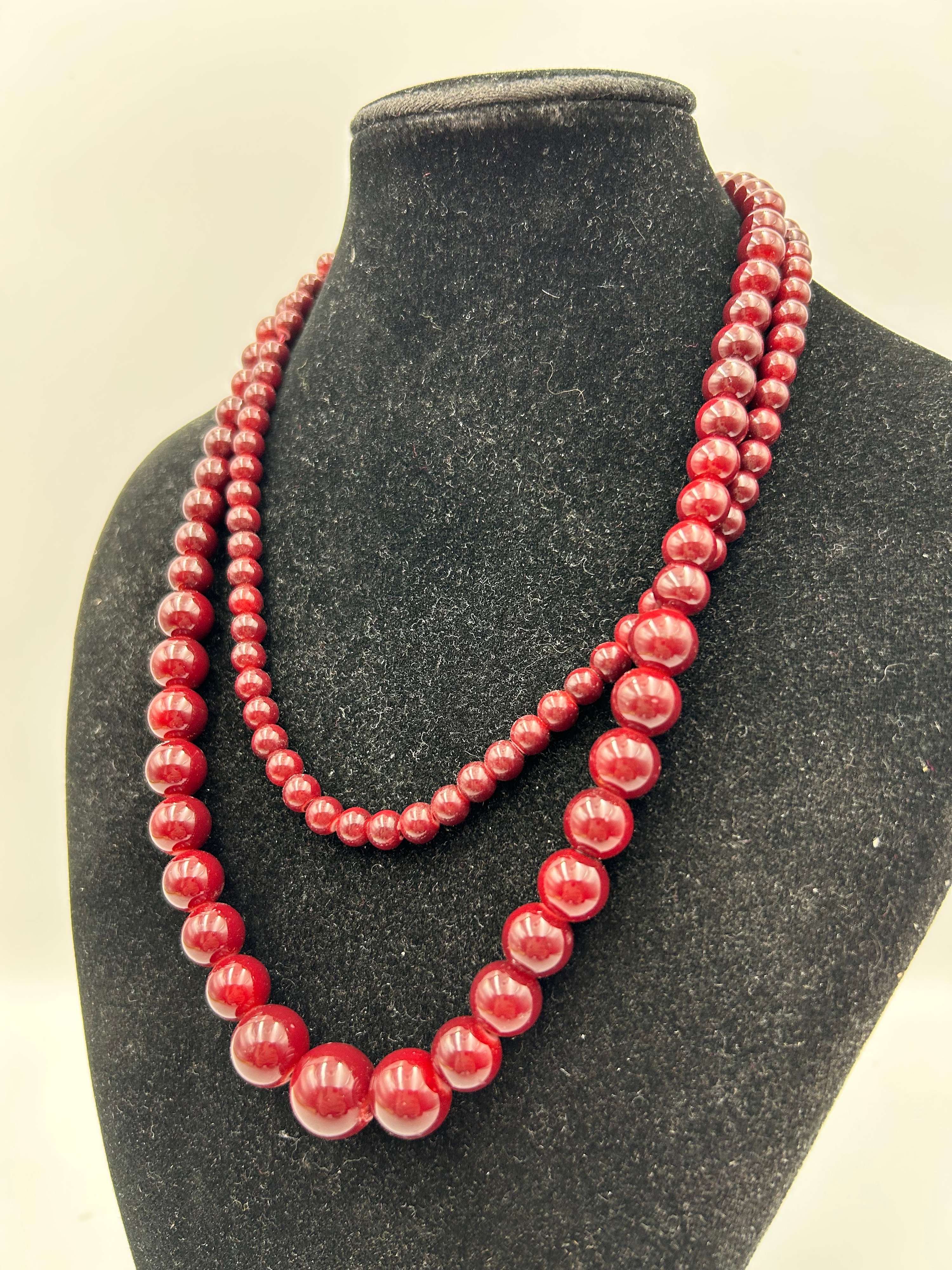 A Vintage Double-Strand Graduated Red Glass Bead Opera Length Necklace