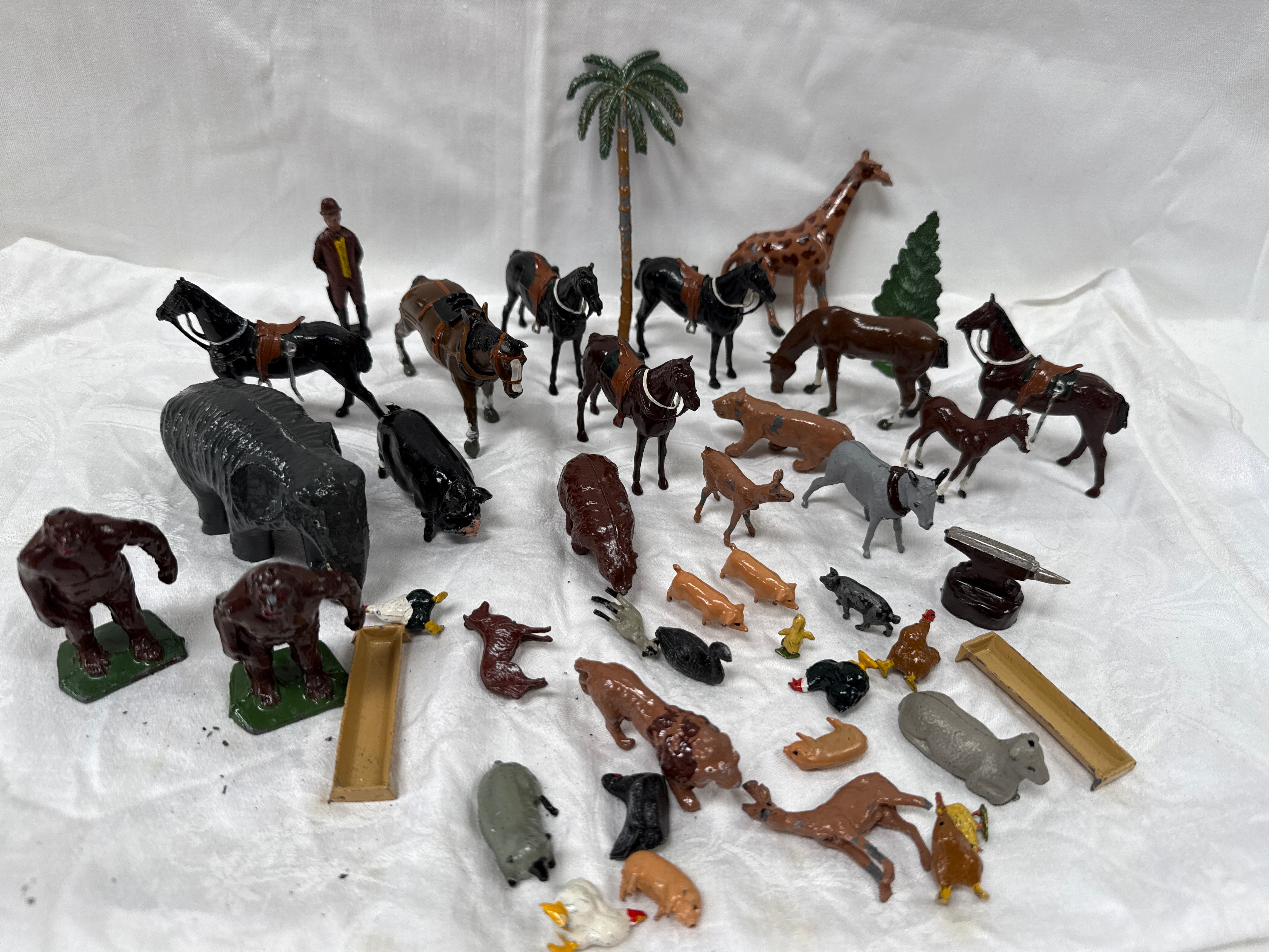 A Collection of Early 20th Century Die-Cast Toy Zoo and Farm Animals and Accessories