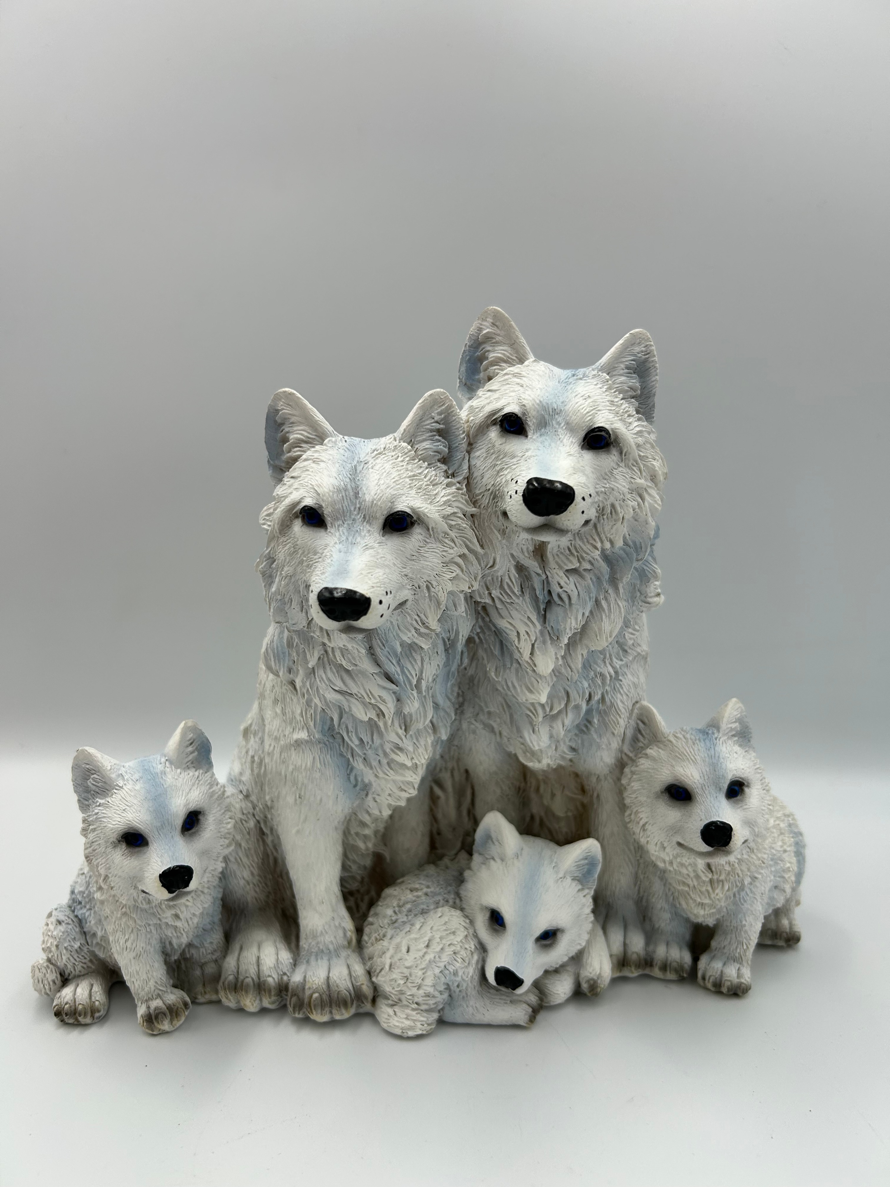 Contemporary Cast Resin Group of Five Arctic Wolves, 20 cm