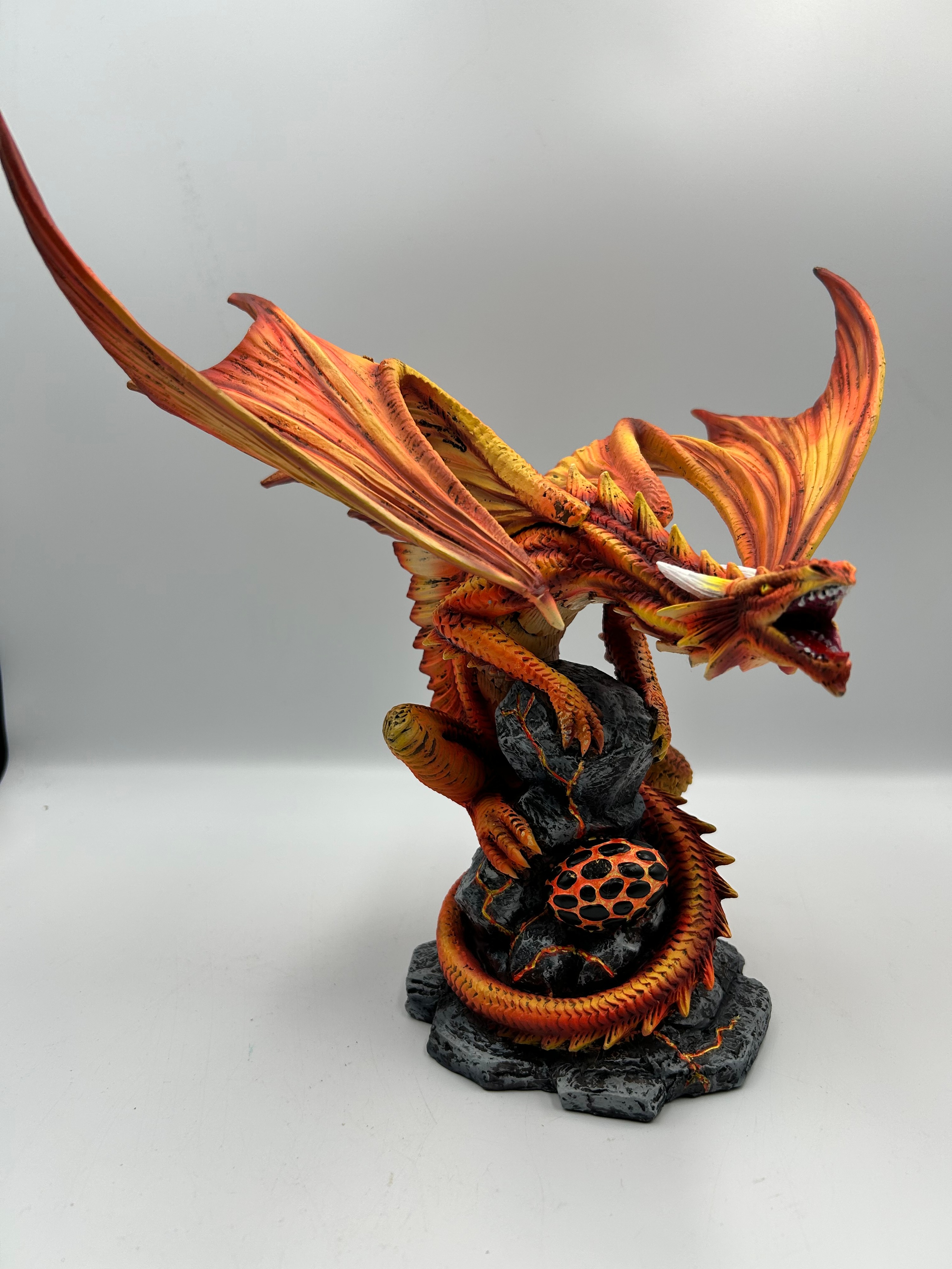 A Contemporary Resin Nemesis Now  Dragon Figurine Guarding a Volcanic Egg, 12"