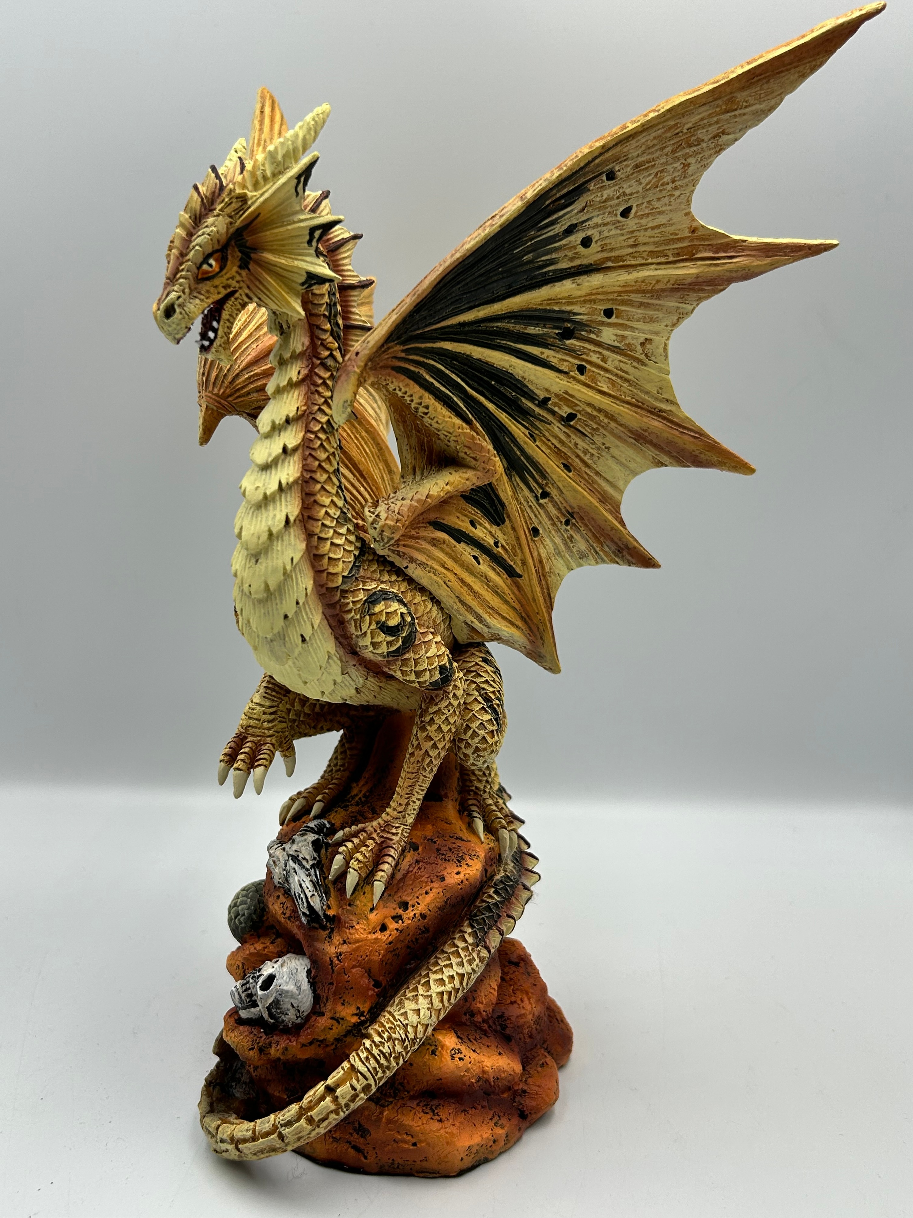 Contemporary Resin Nemesis Now Dragon Figurine Crouching on a Rocky Base with Skulls