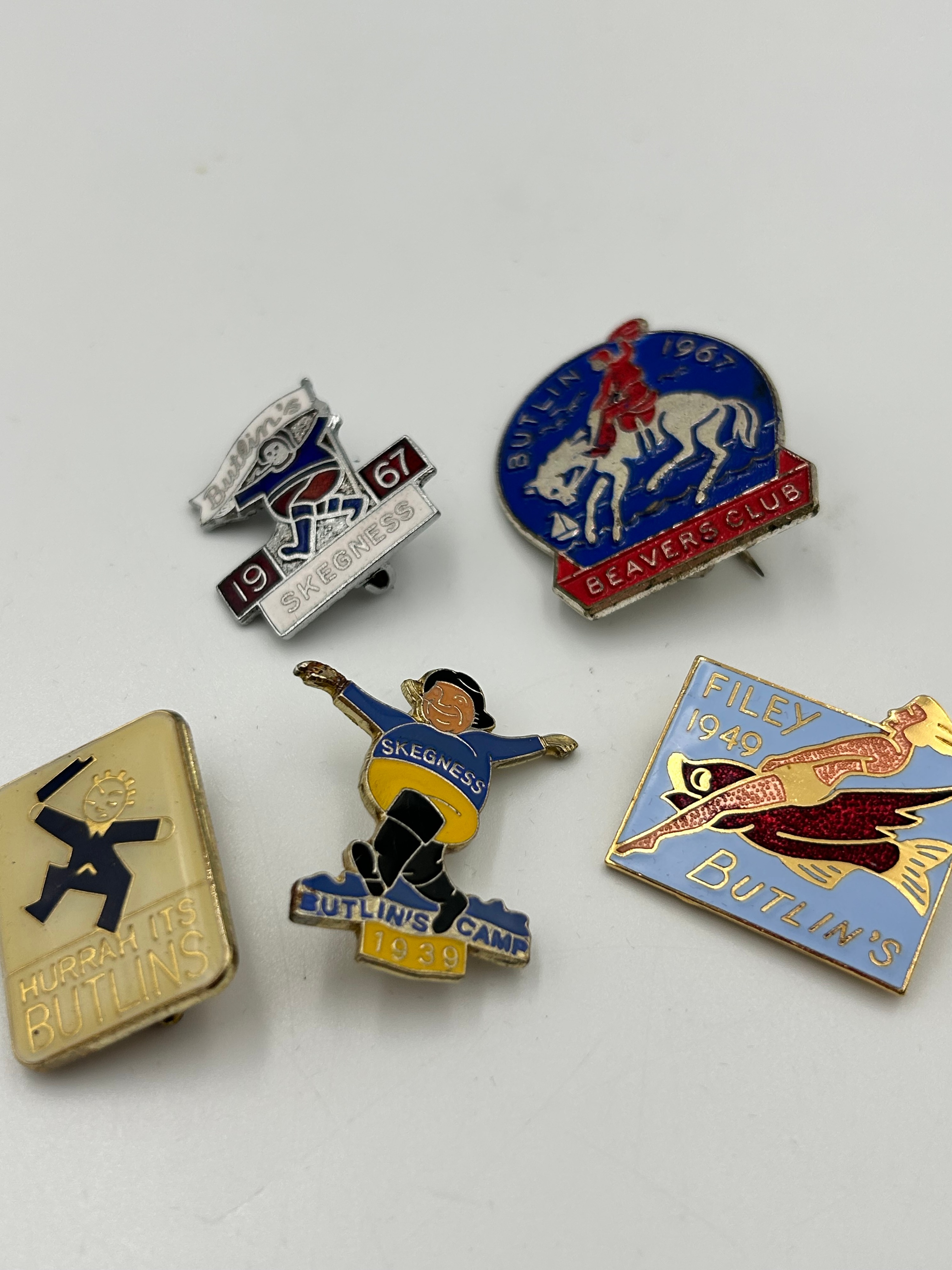 A Collection of Butlin's Enamel Holiday Camp Lapel Badges, 1939 to 1967