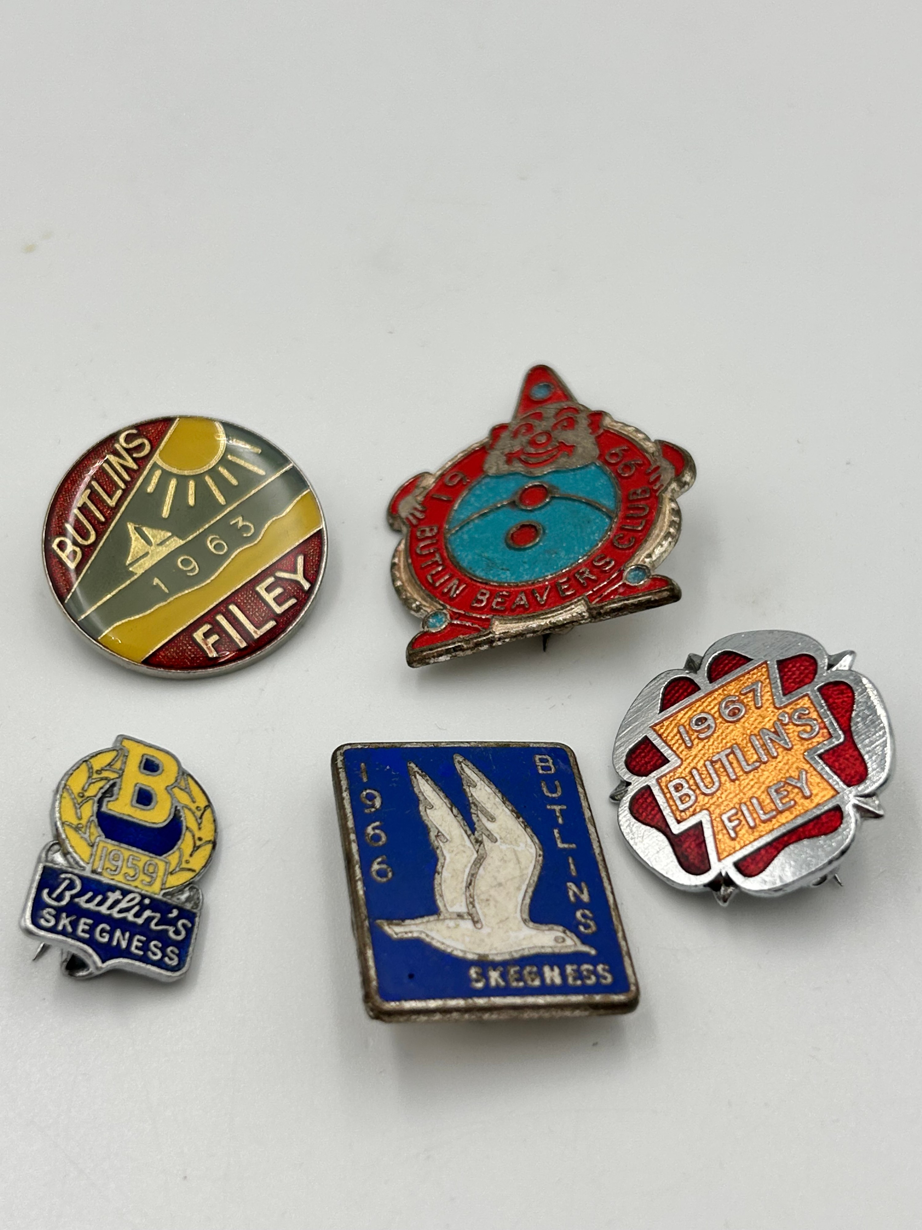 A Collection of Butlin's Enamelled Metal Souvenir Holiday Camp Badges, 1959-1967
