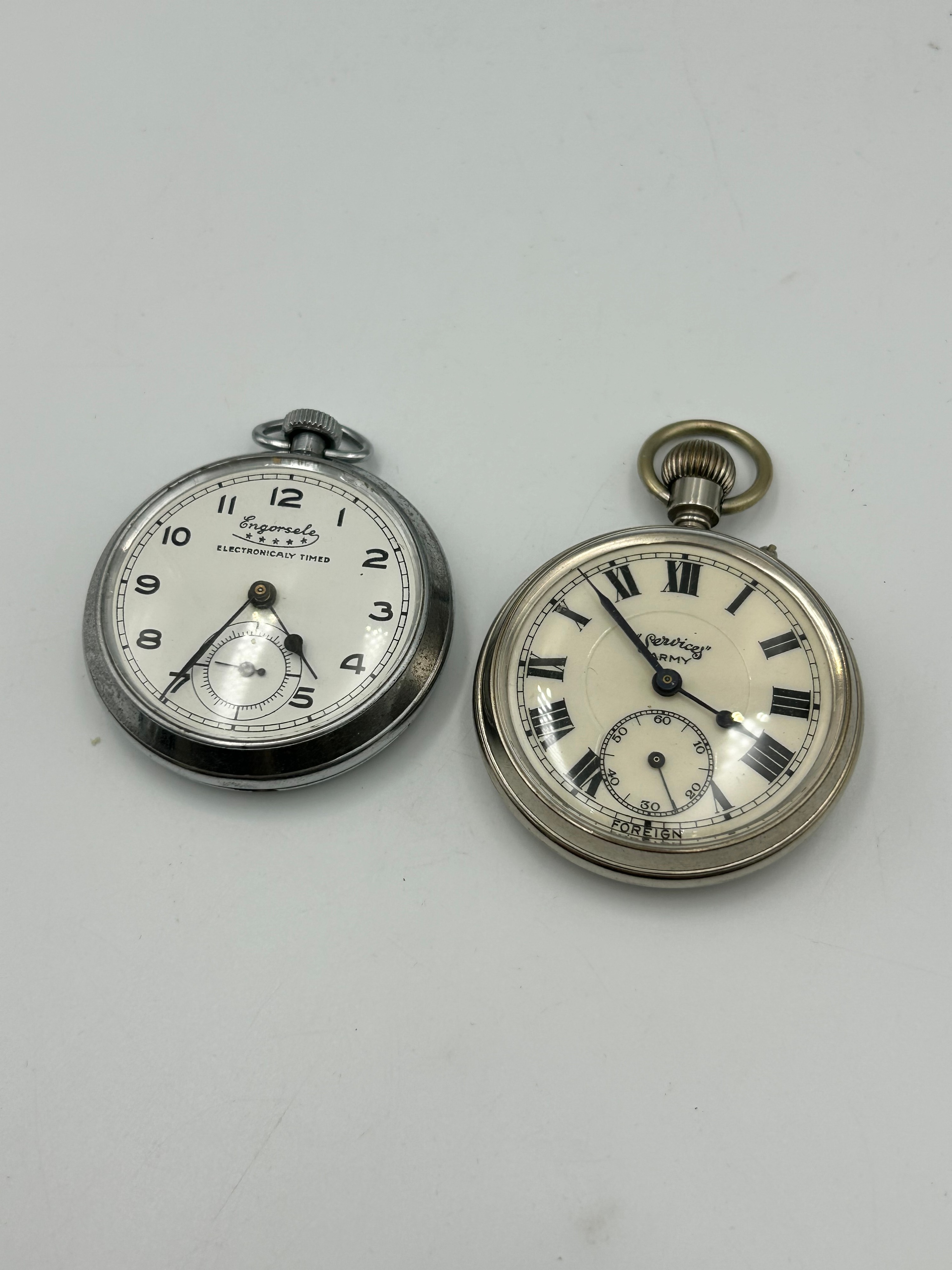 Services Army and Engorsele Electronically Timed White Metal Pocket Watches ,Running When Listed
