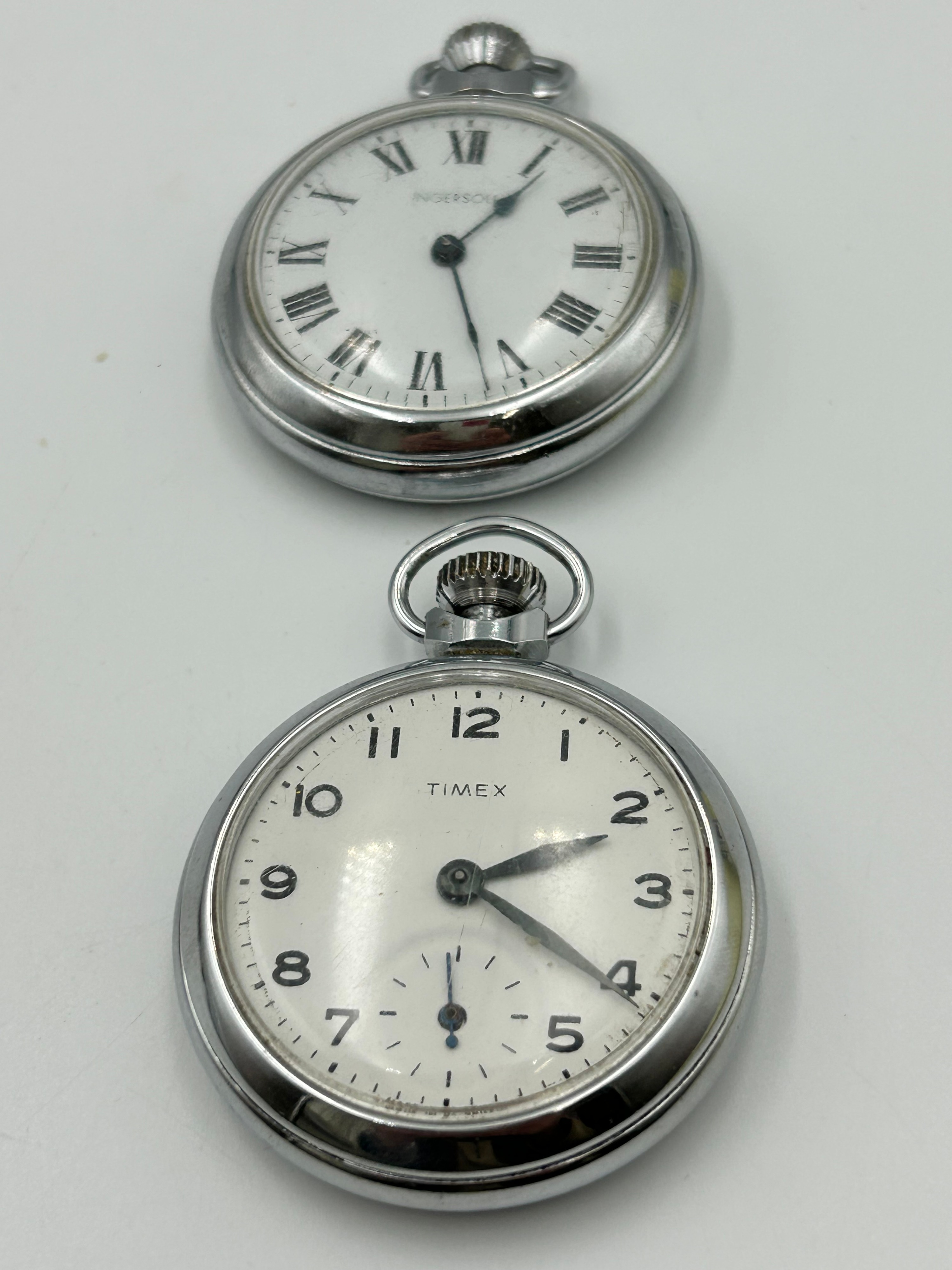 A Collection of Ingersoll and Timex White Metal Open-Face Pocket Watches,Running When Listed