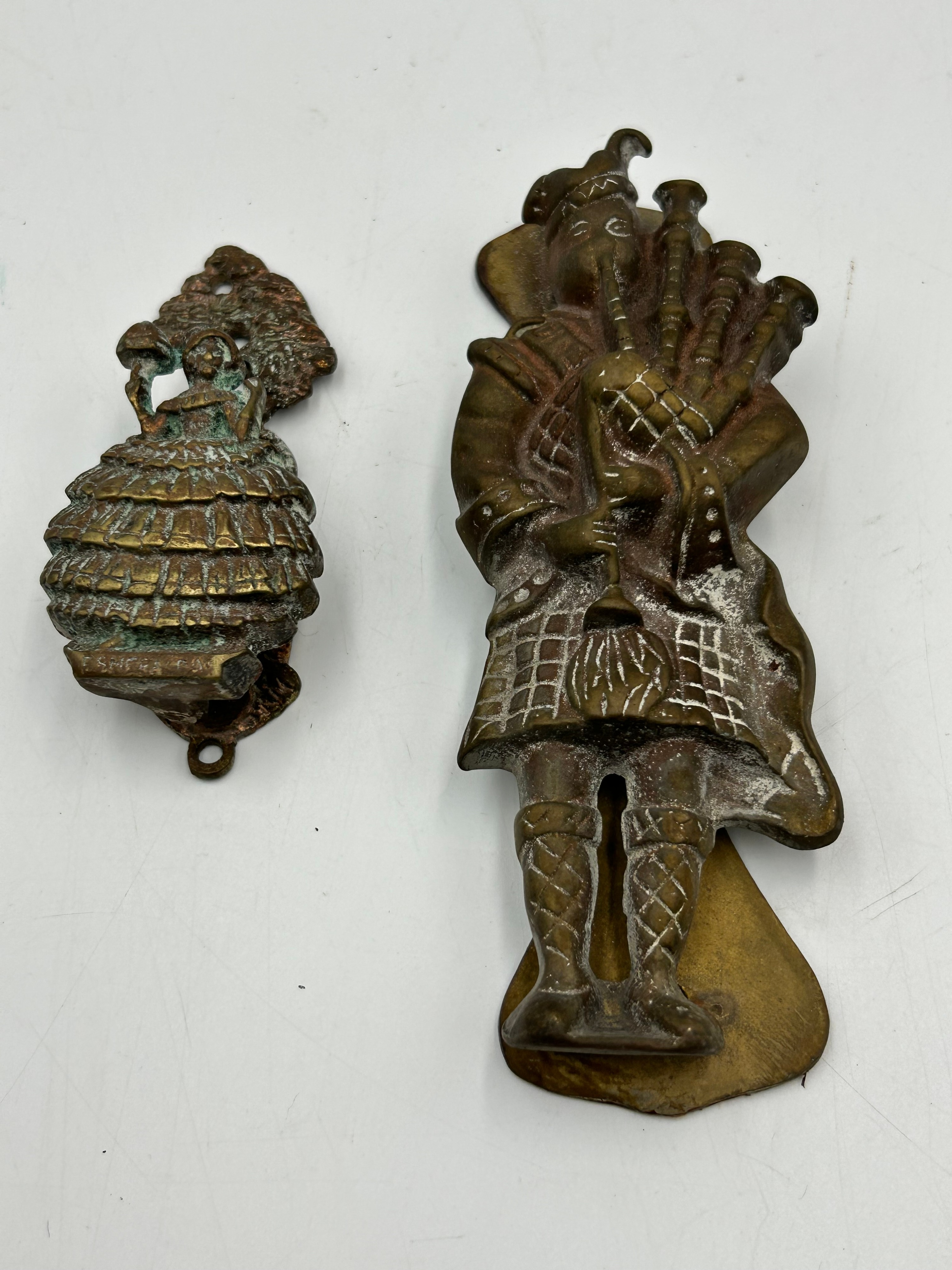 A Vintage Cast Brass Scottish Bagpiper and Peerless Door Knockers