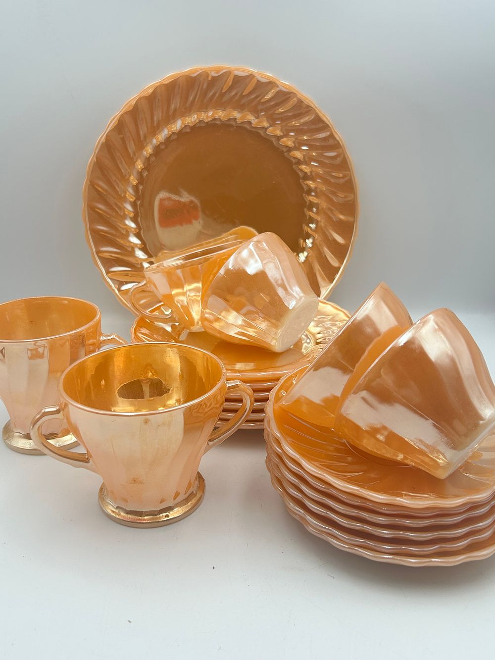 Lot 474: Fire-King? Peach Lustre Swirl Pattern Glass Tea Service