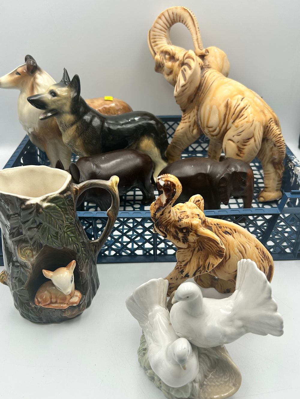 Lot 477: An Assortment of Glazed Ceramic Animal Figurines and a Woodland Tree Trunk Vessel
