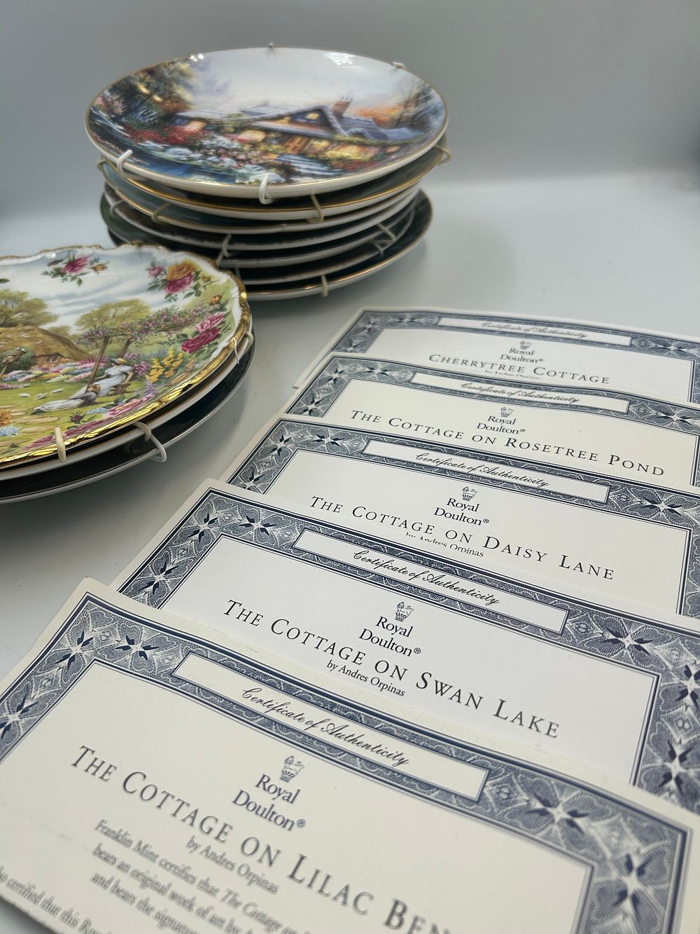 Lot 486: A Collection of Royal Doulton Porcelain The Cottage Series Collector Plates by Andres Orpinas, And Others