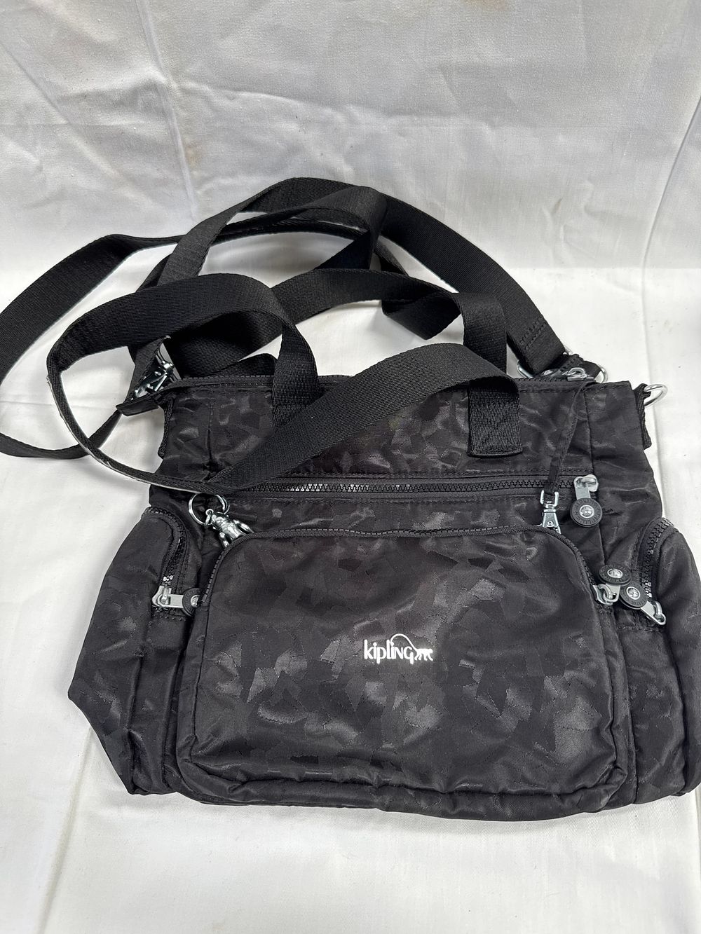 Lot 530: Kipling Tacita? Black Jacquard Multi-pocket Shoulder Bag
