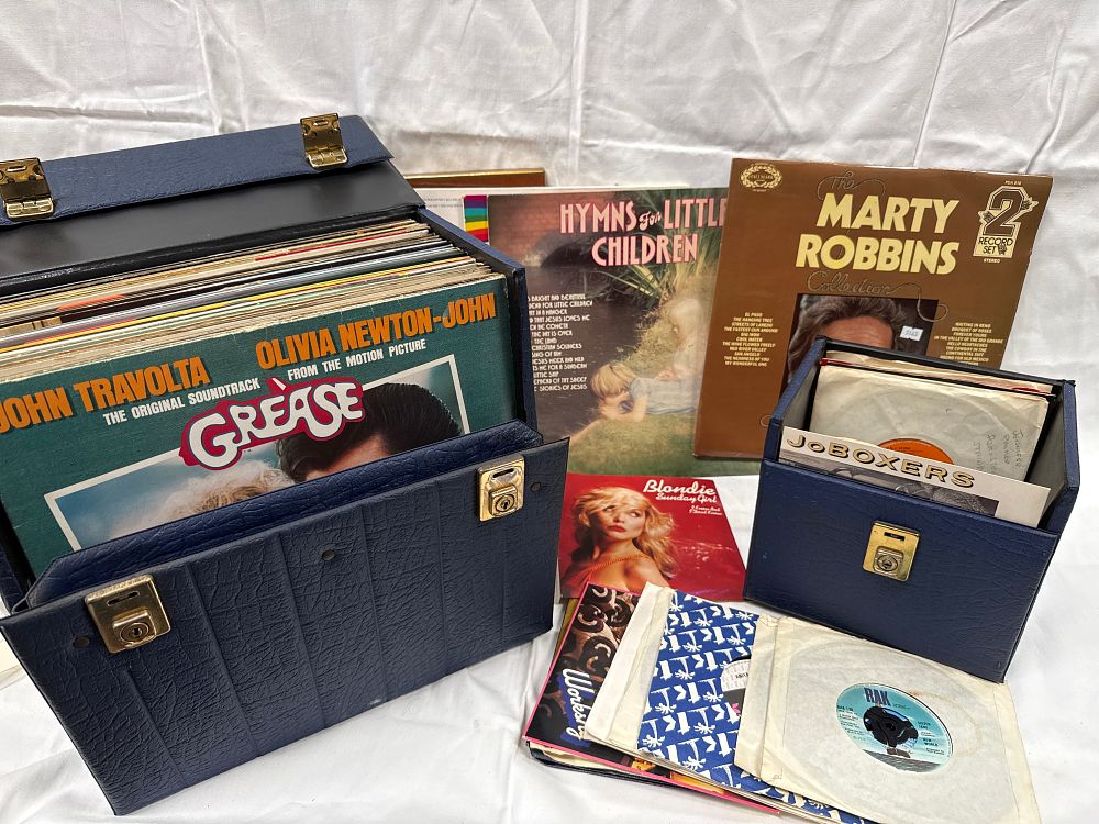 Lot 548: A Collection of Vinyl LPs and 7 Inch Singles in Textured Cases, Late 20th Century