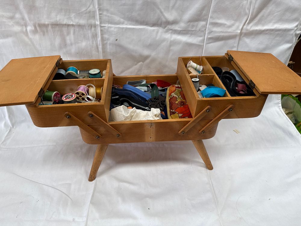 Lot 555: Mid-Century Modern? Wooden Cantilever Sewing Box on Tapered Legs