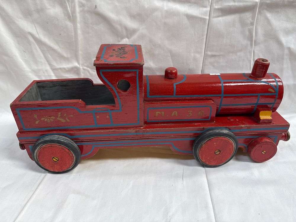 Lot 568: A Mid-20th Century? Wooden Push-Along Locomotive Marked M. A. 3. R. ?