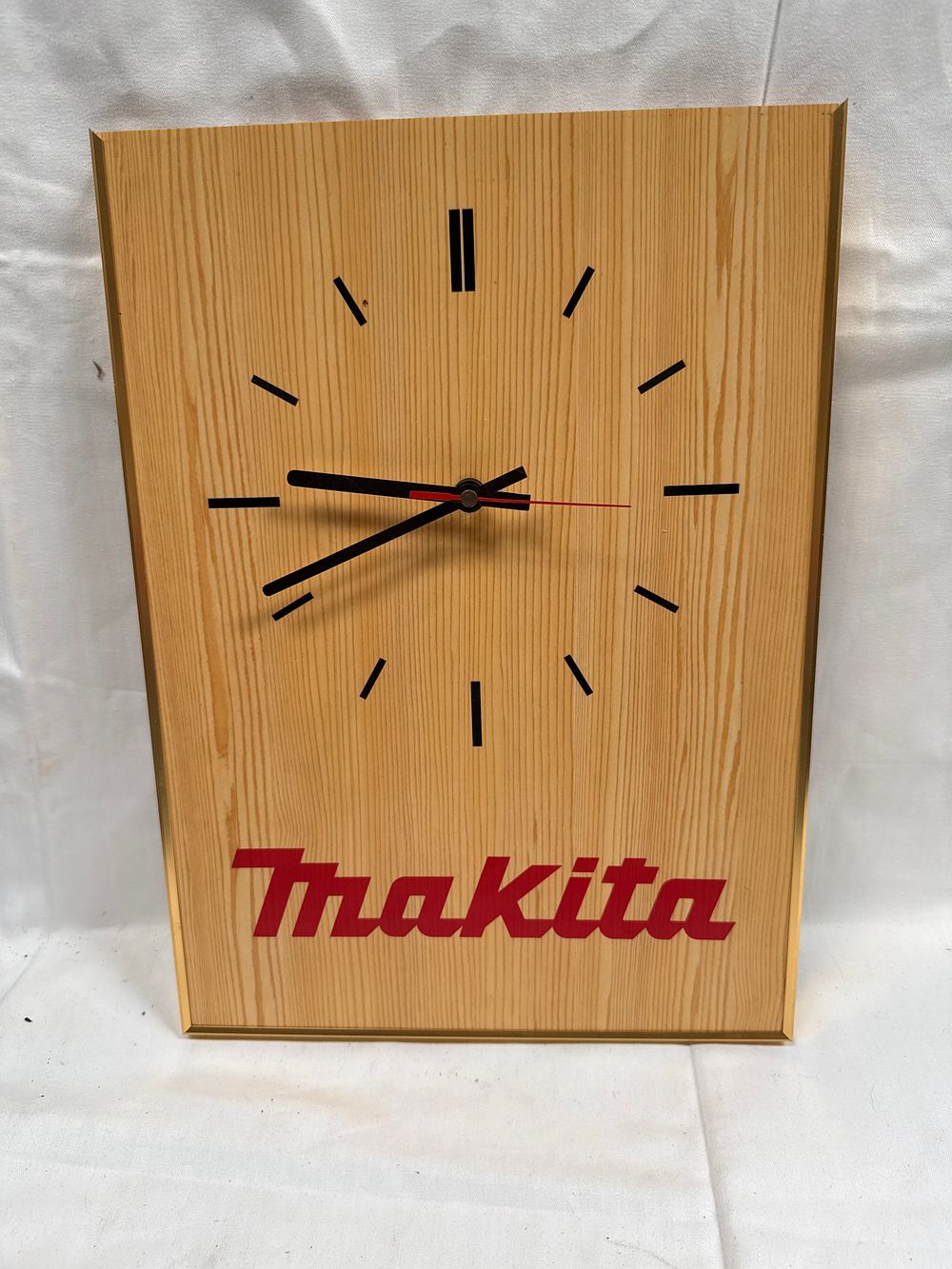 Lot 588: Makita Wood Veneer and Gilt Metal Effect Rectangular Wall Clock AF