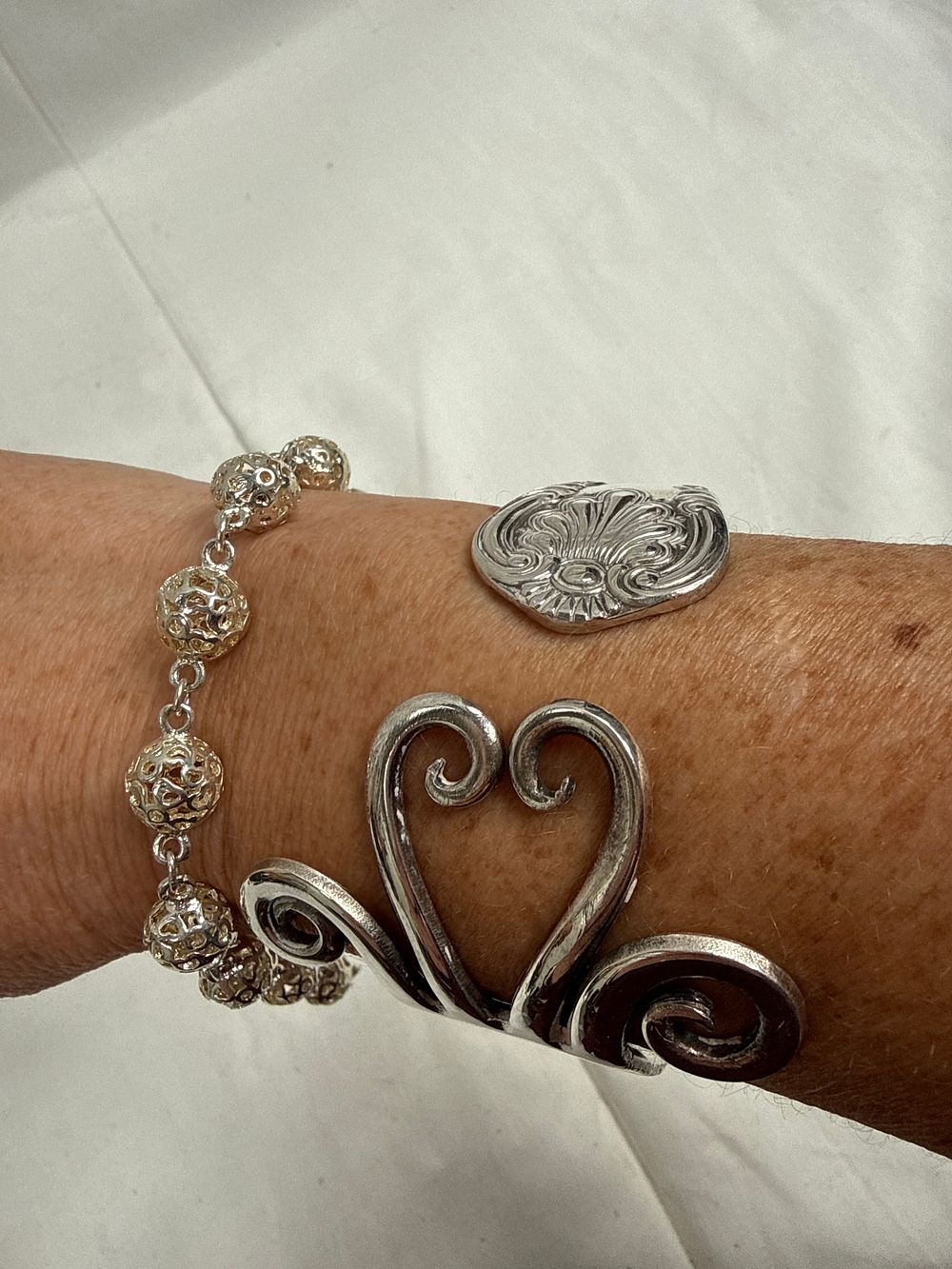Lot 637: Reed & Barton Francis I? Pattern Repurposed Fork Cuff and a Filigree Silver Bracelet