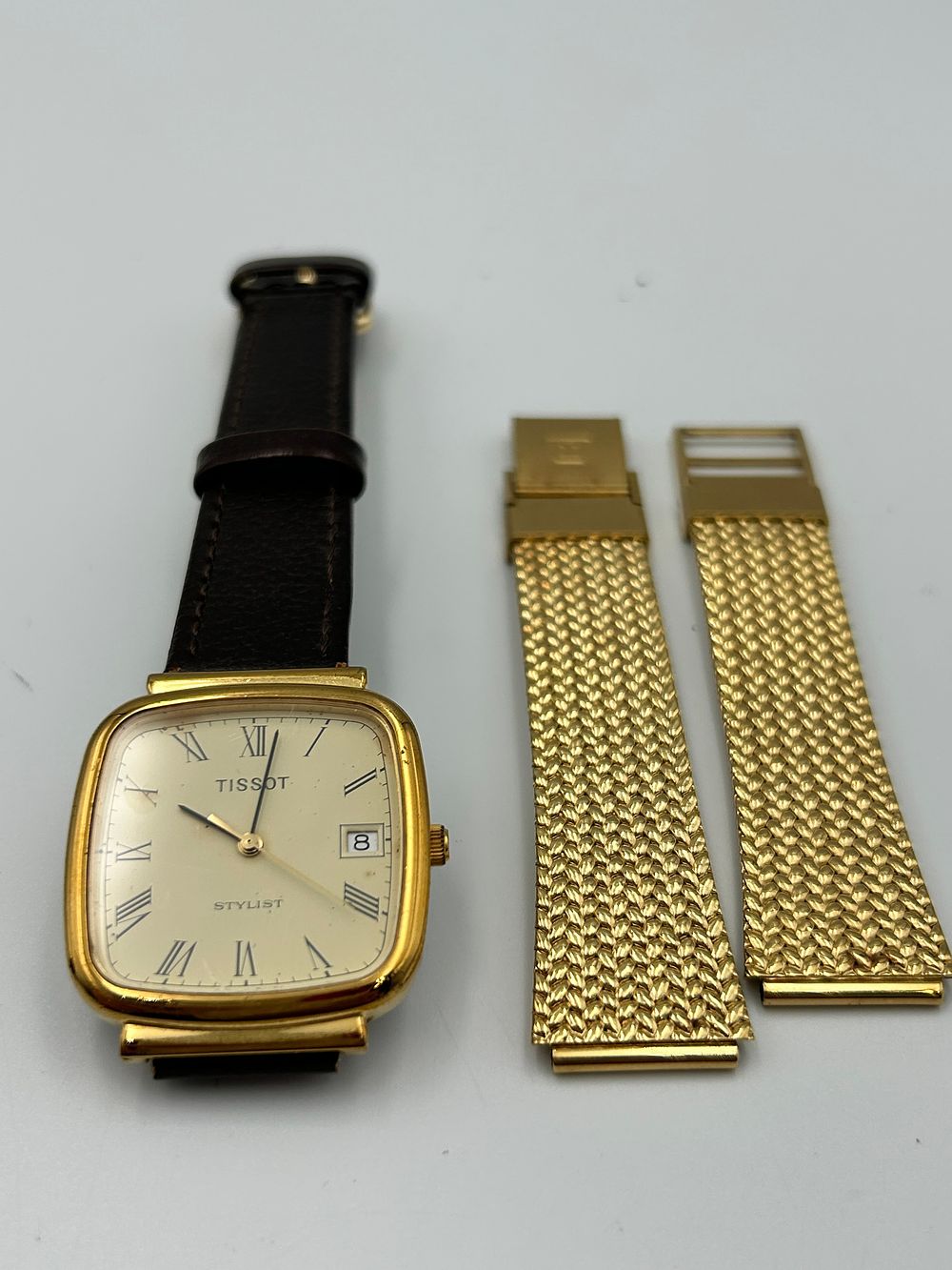 Lot 805: Tissot Stylist Gilt-Metal Effect Quartz? Wristwatch Plus Extra Strap ,Running When Listed.
