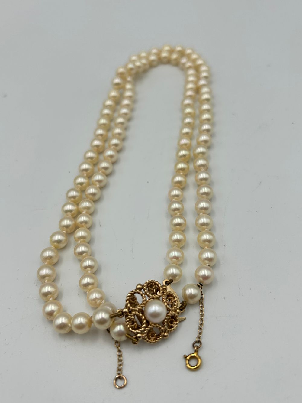 Lot 815: Vintage? 9 Carat Yellow Gold? and Pearl Double Strand Necklace with Ornate Clasp