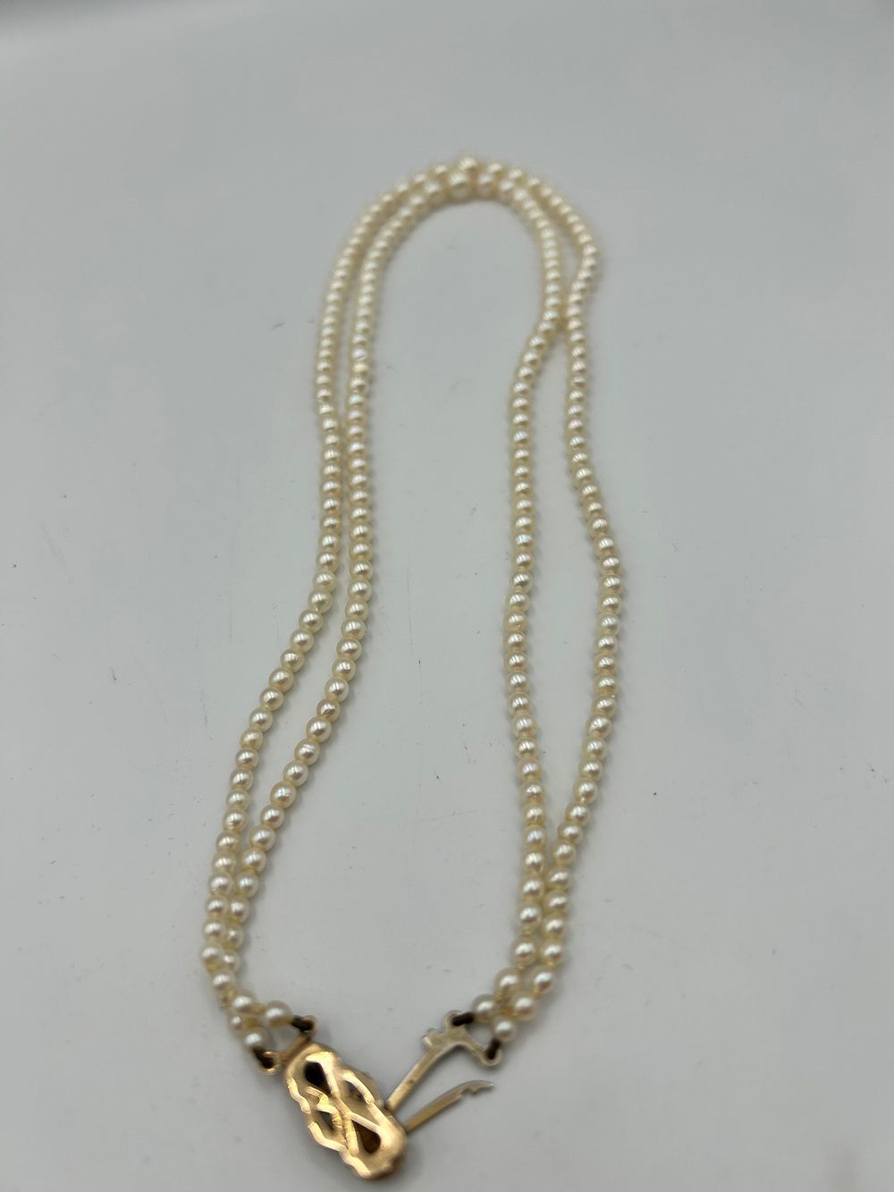 Lot 816: Late 20th Century 9ct Gold and Pearl Double Strand Necklace, London, 1971