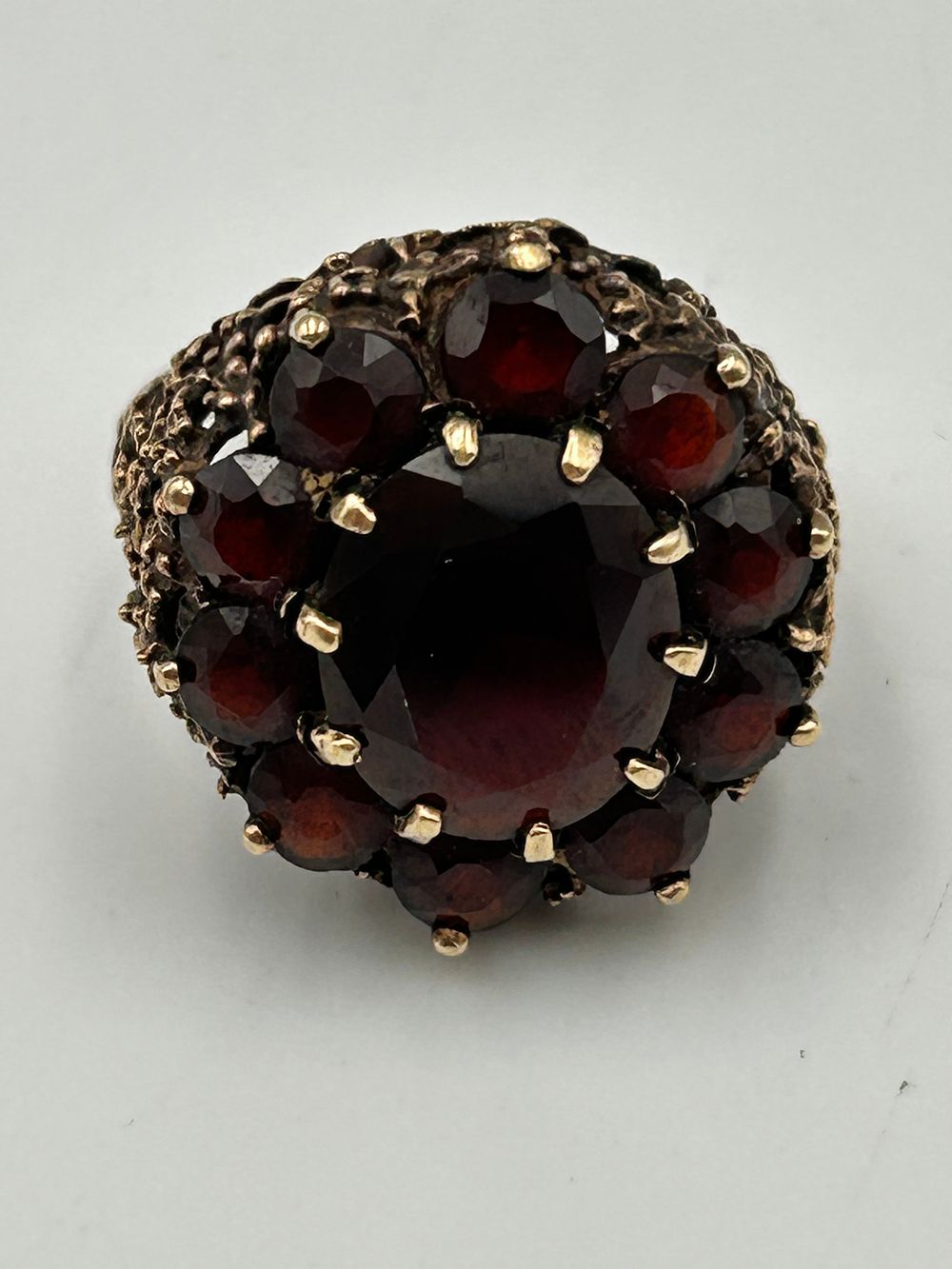Lot 828: A 1970s? 9ct Yellow Gold and Garnet Cluster Cocktail Ring, 7.19g