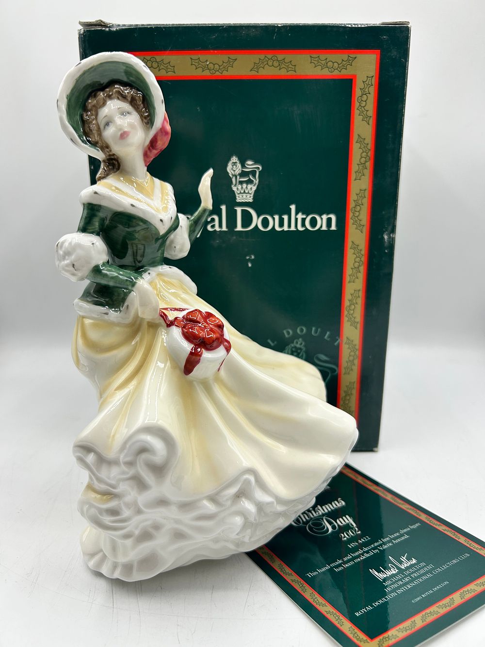 Lot 865: Royal Doulton Bone China Figurine Christmas Day 2002 by Valerie Annand HN 4422