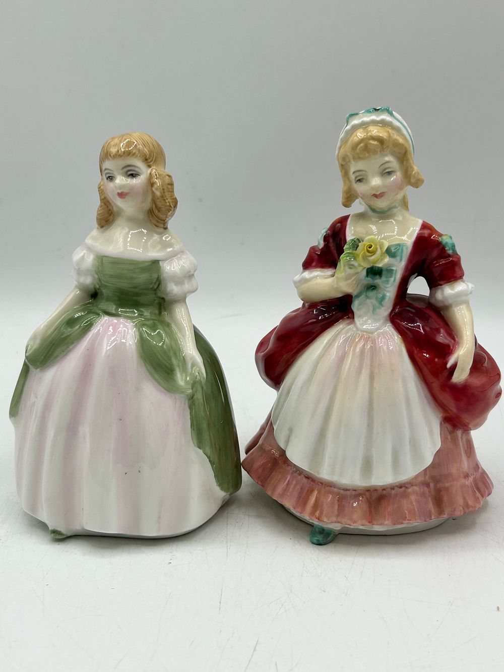 Lot 874: Royal Doulton Bone China Valerie and Penny Figurines by Peggy Davies?