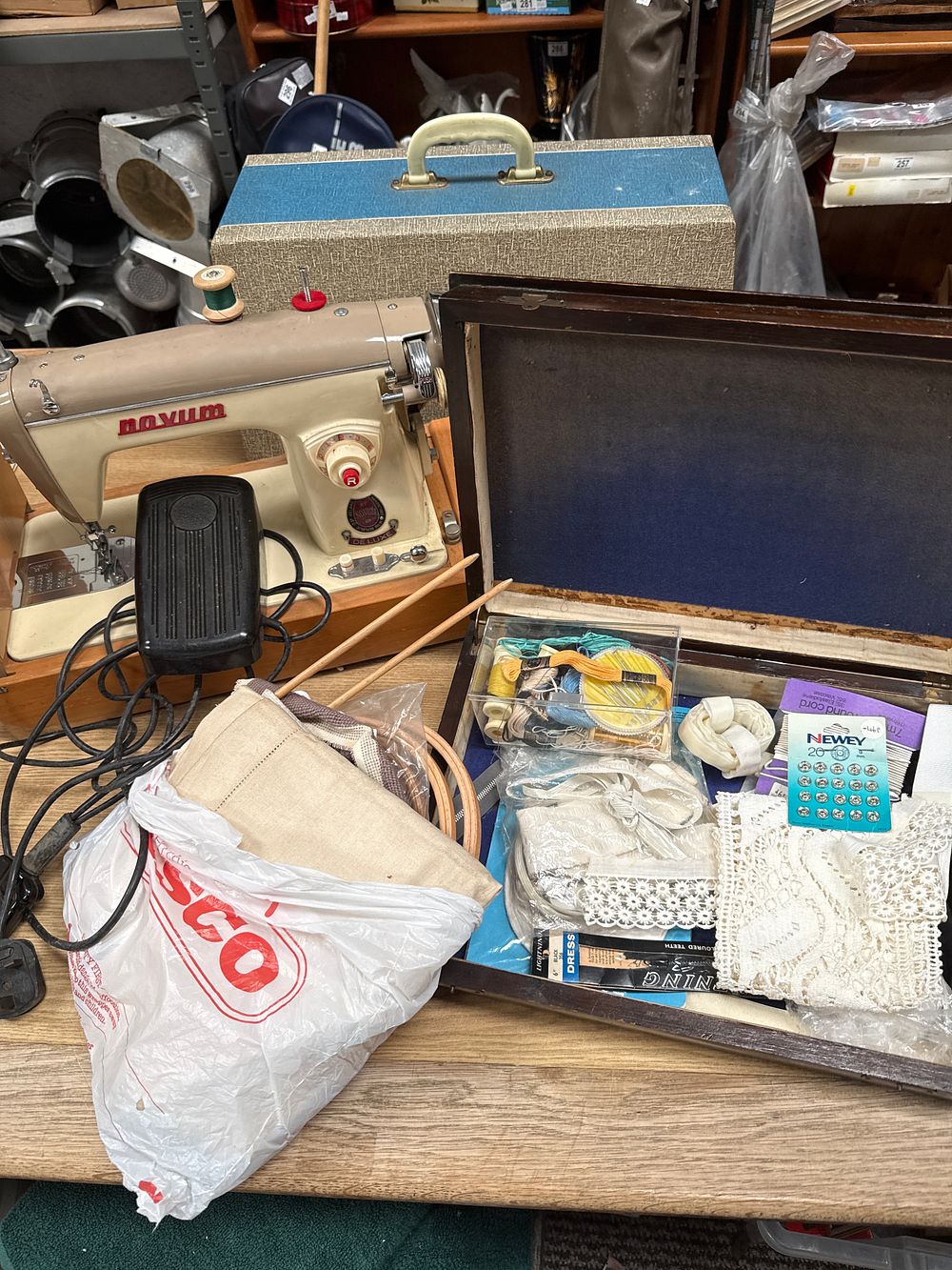 Lot 910: Novum Deluxe Enamelled Electric Sewing Machine with Wooden Case and Craft Accessory Collection