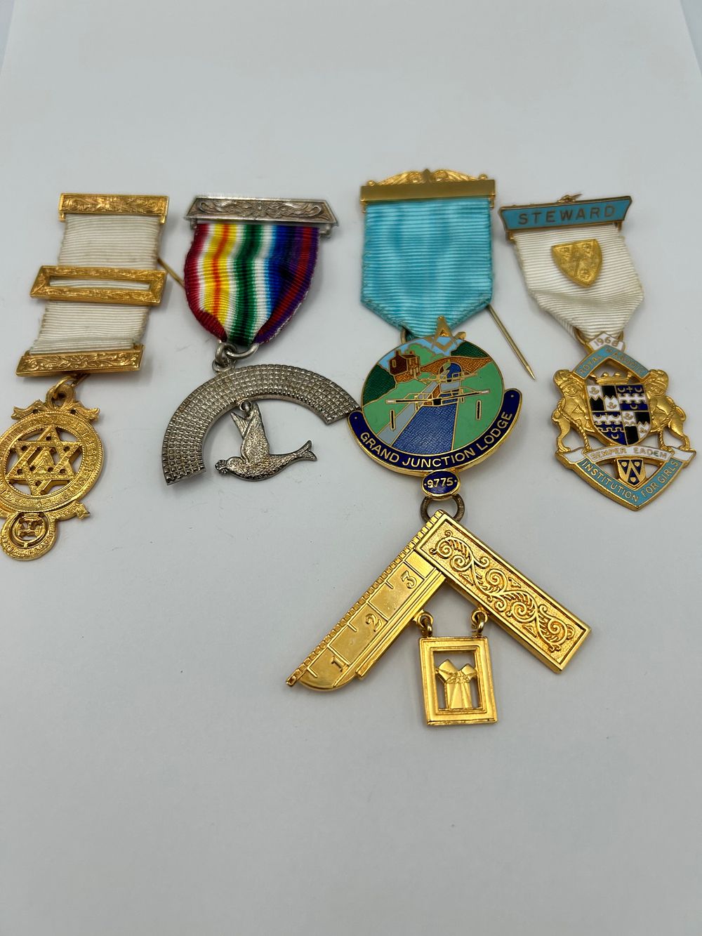 Lot 927: A Collection of Enamelled Gilt Metal Effect and White Metal Masonic Jewels, 20th Century