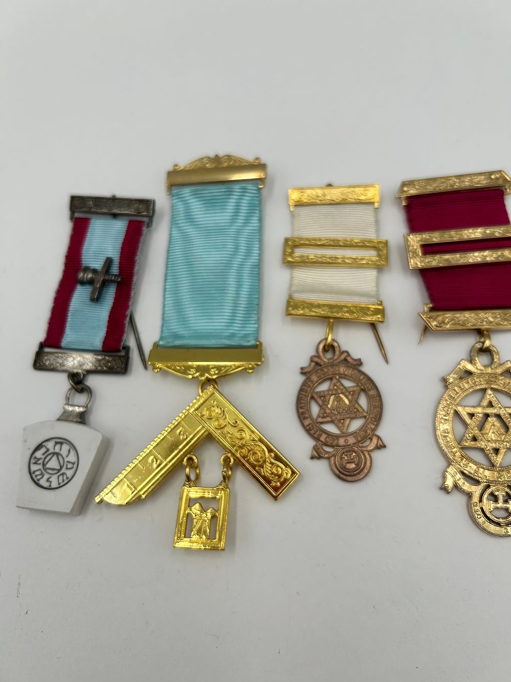 Lot 935: A Collection of Gilt-Metal Effect and White Metal Masonic Breast Jewels