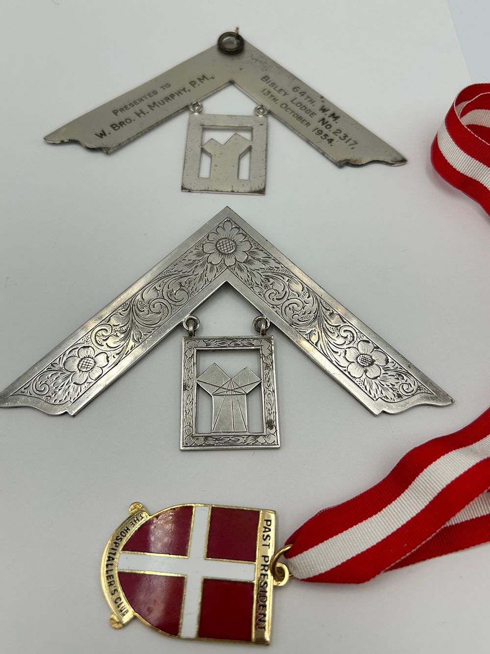 Lot 937: Mid-20th Century White Metal Masonic Past Master Collar Jewels? and A Club Medal, 1954