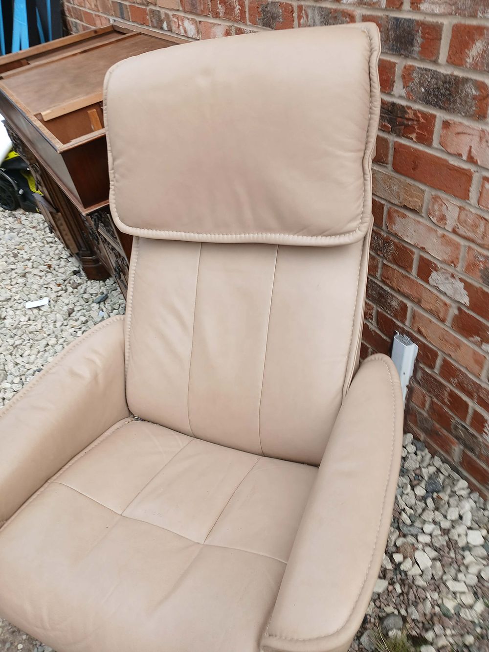 Lot 964: A Contemporary Tan Leather Reclining Armchair and Mismatched Footstool?
